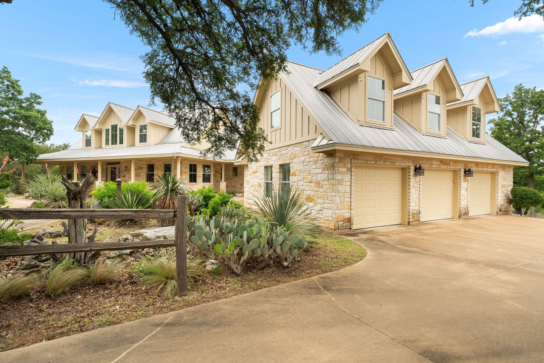 Stone and siding exterior with a metal roof, feat