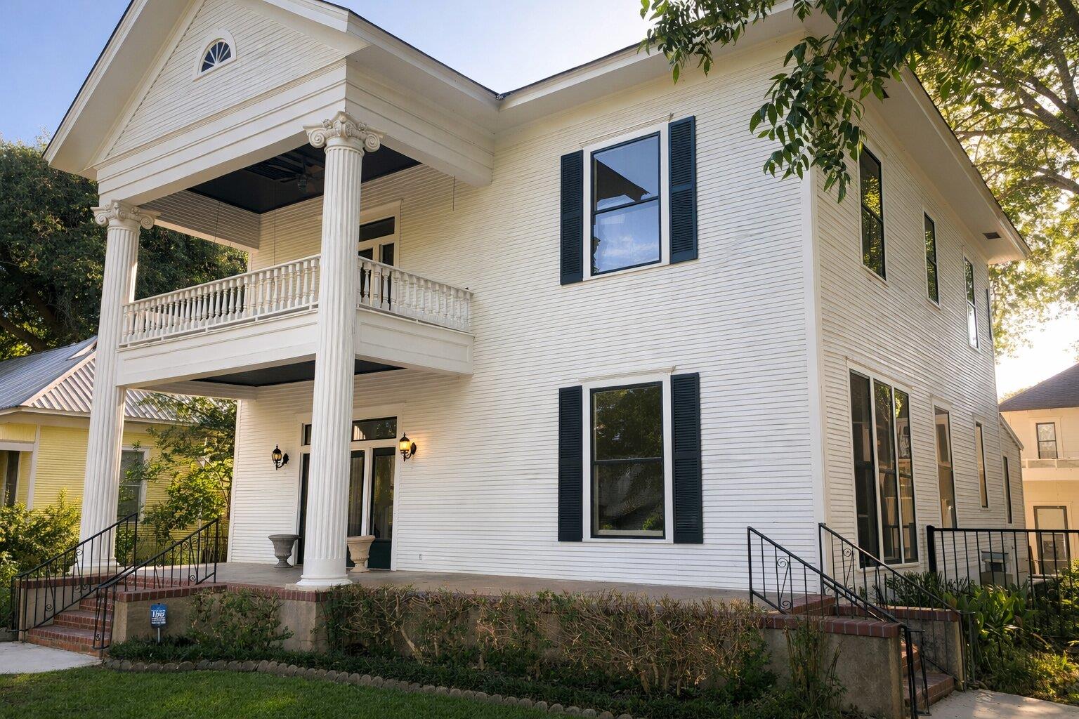 Greek revival inspired property with a balcony an