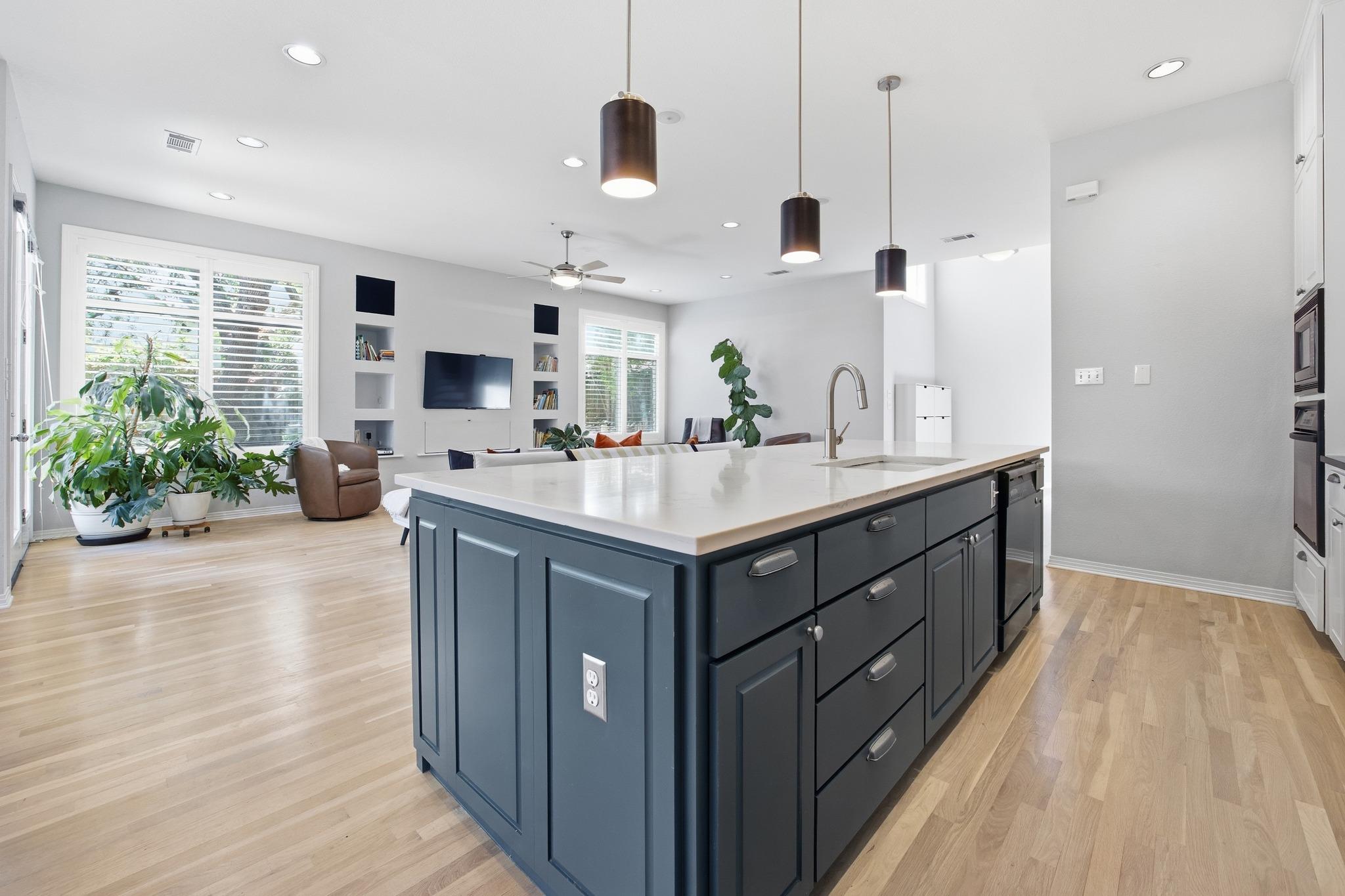 Kitchen featuring open floor plan, an island with