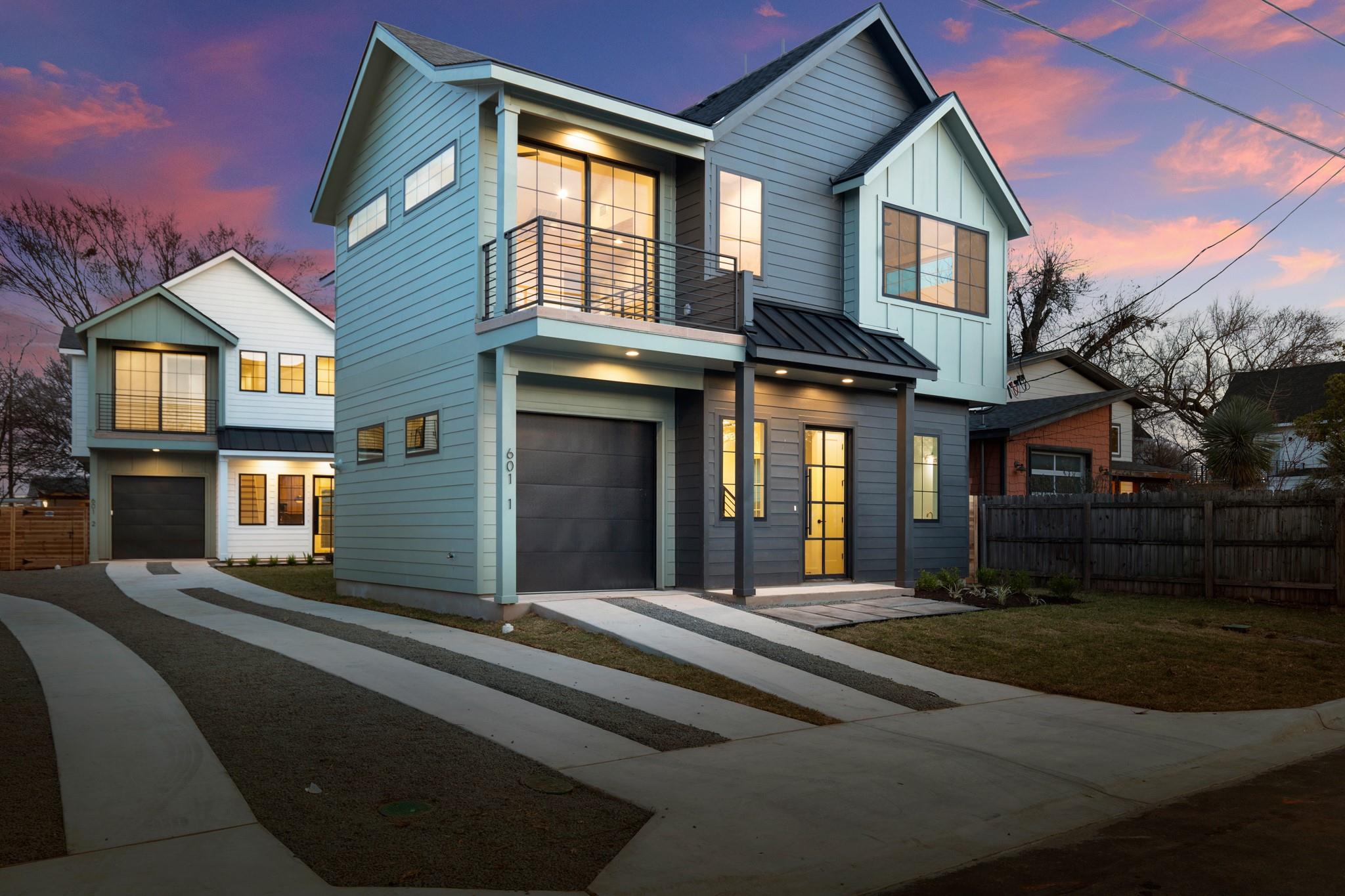 Contemporary home featuring a balcony, an attache