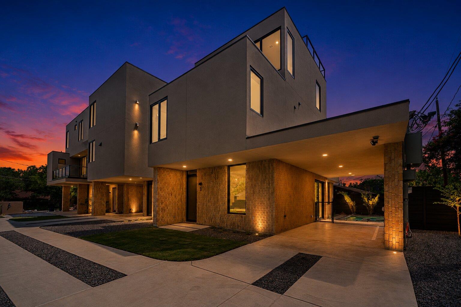 Modern architecture glows under a vibrant sunset,