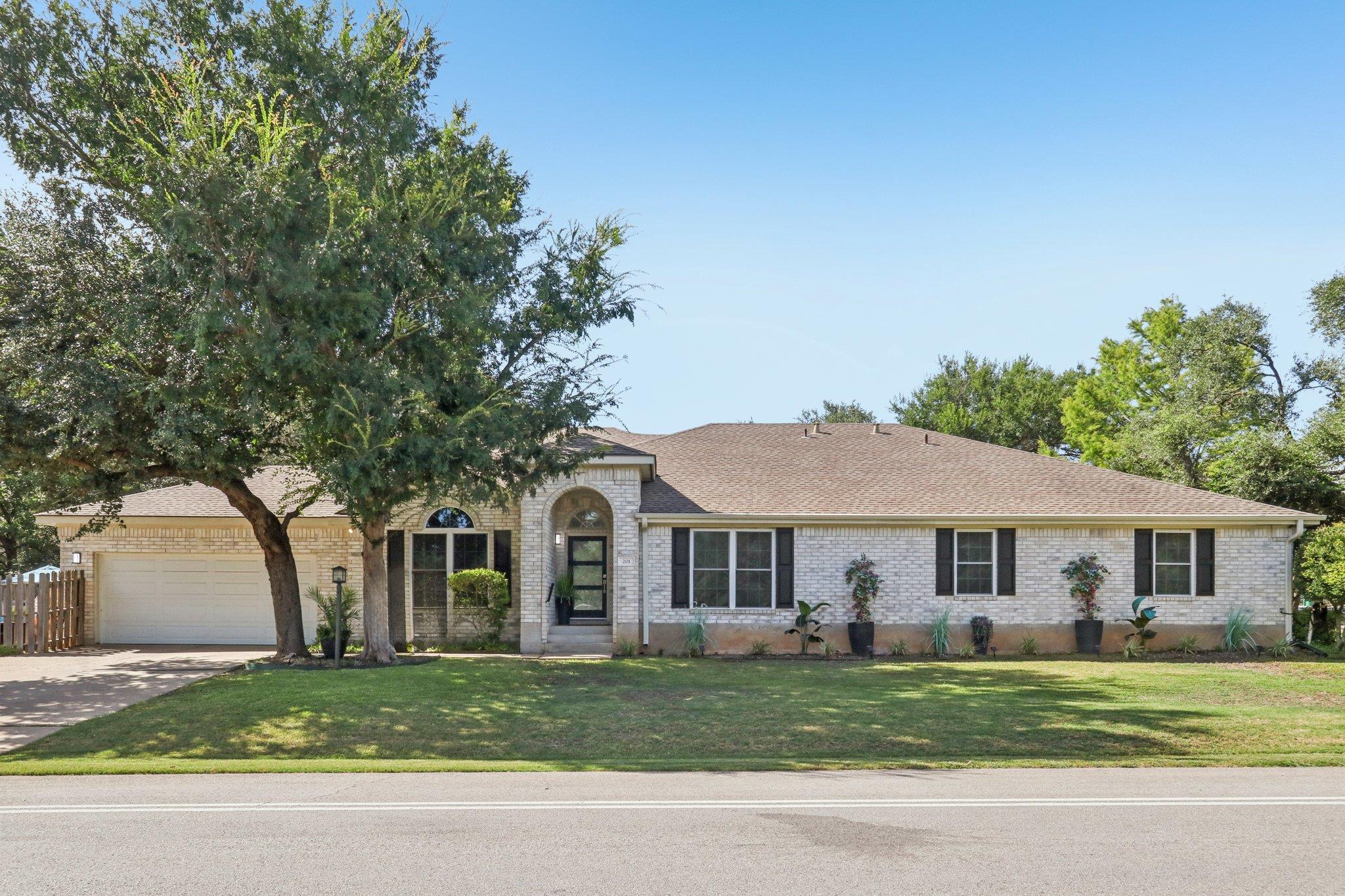 Single-story residence featuring light-colored br
