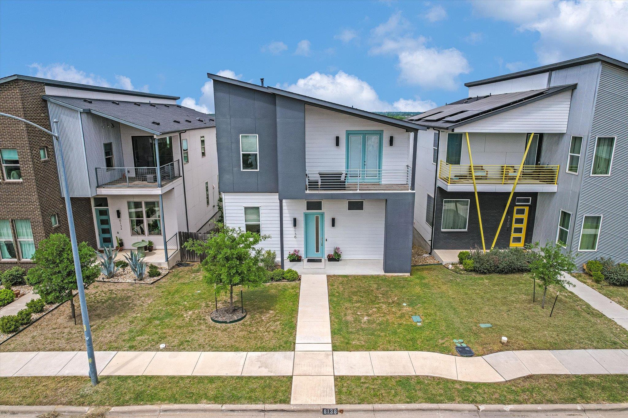 View of front of property with a balcony and a fr