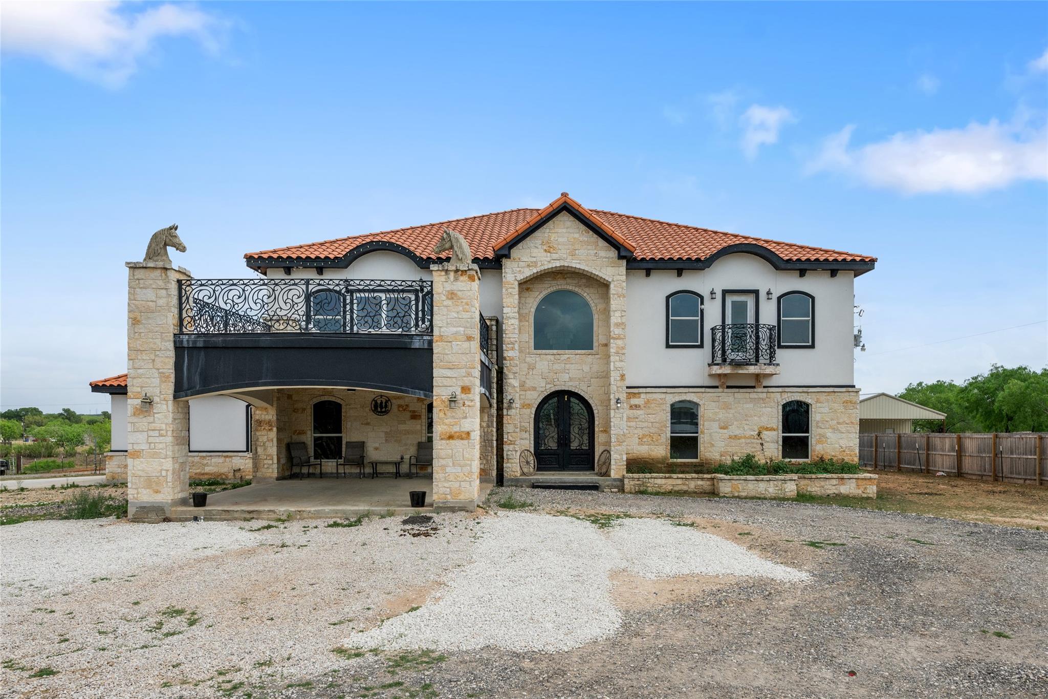 Mediterranean / spanish-style house featuring sto