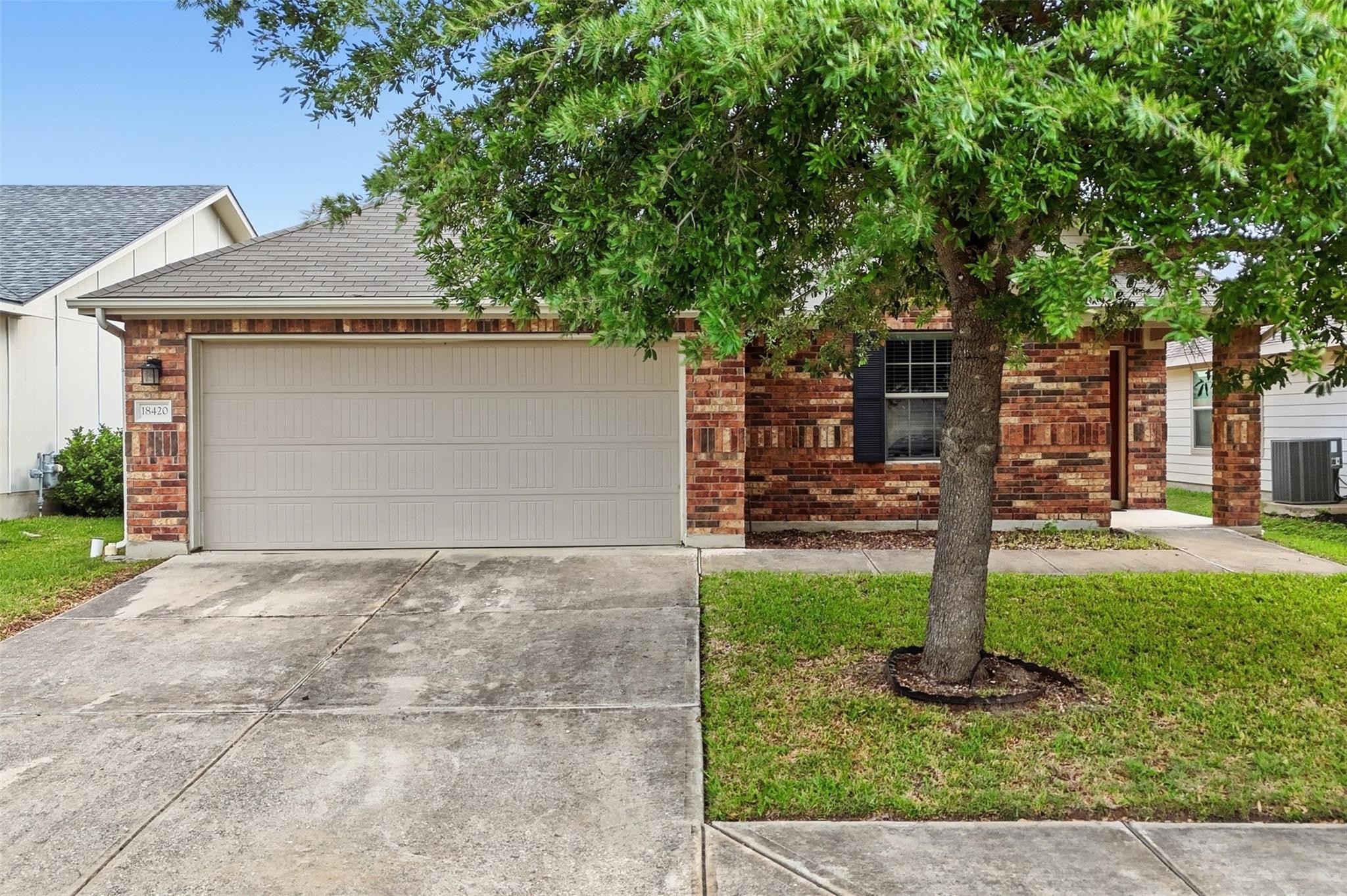 The property features a brick exterior, an attach