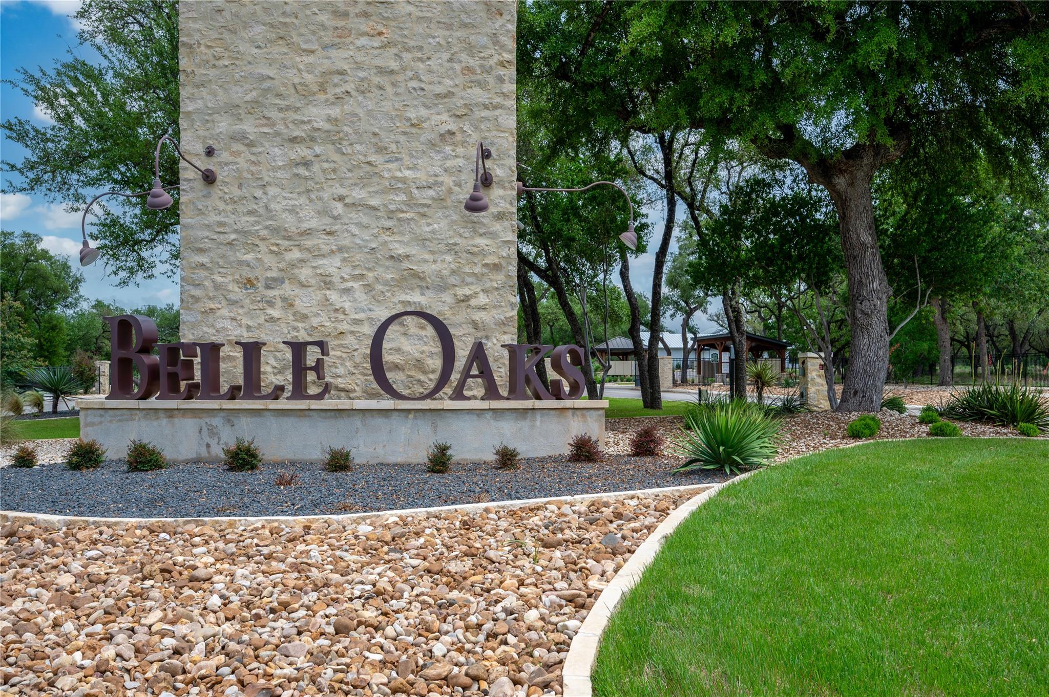 The property entrance features a stone monument w