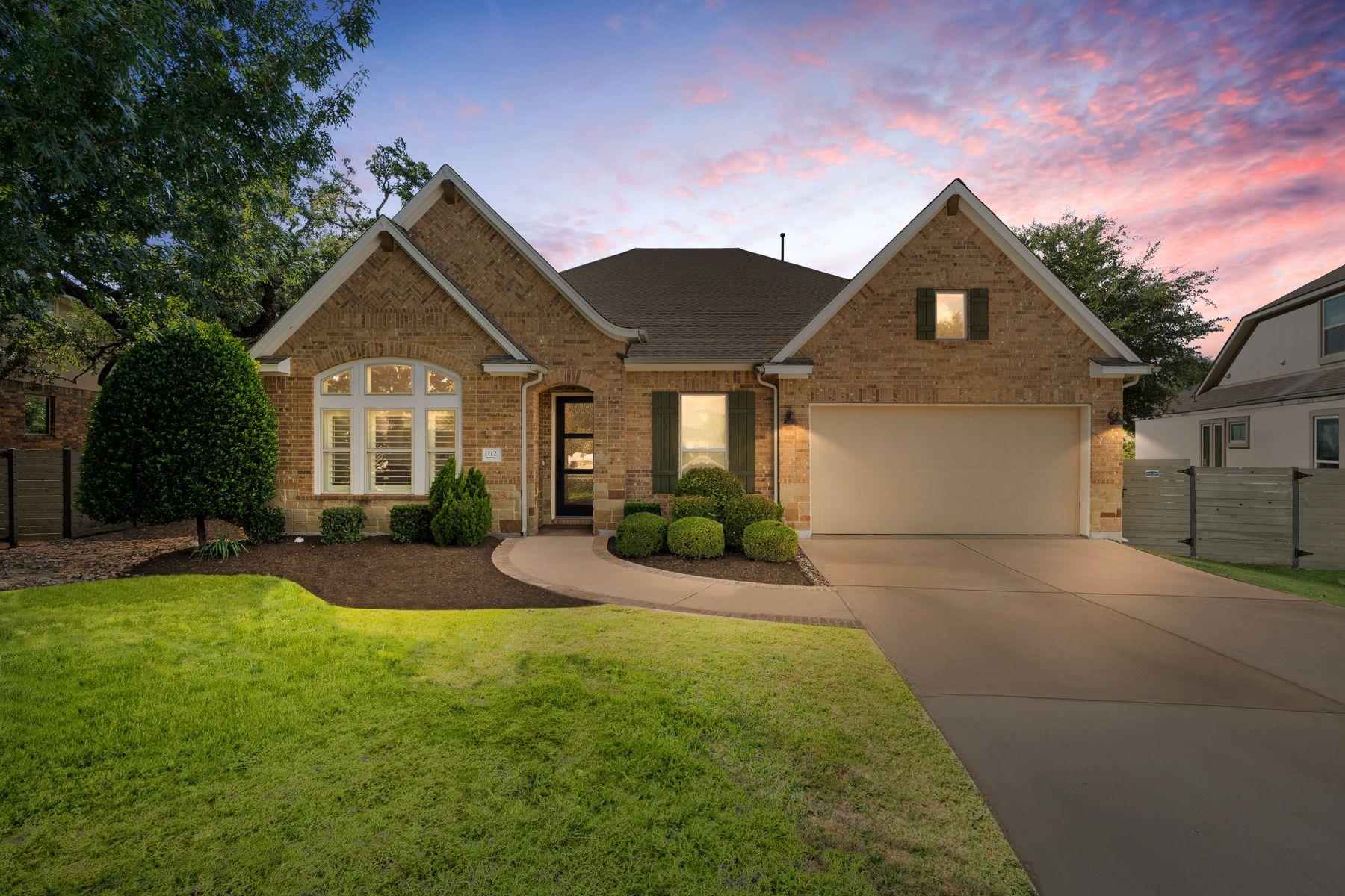 Stately brick exterior anchors this elegant singl