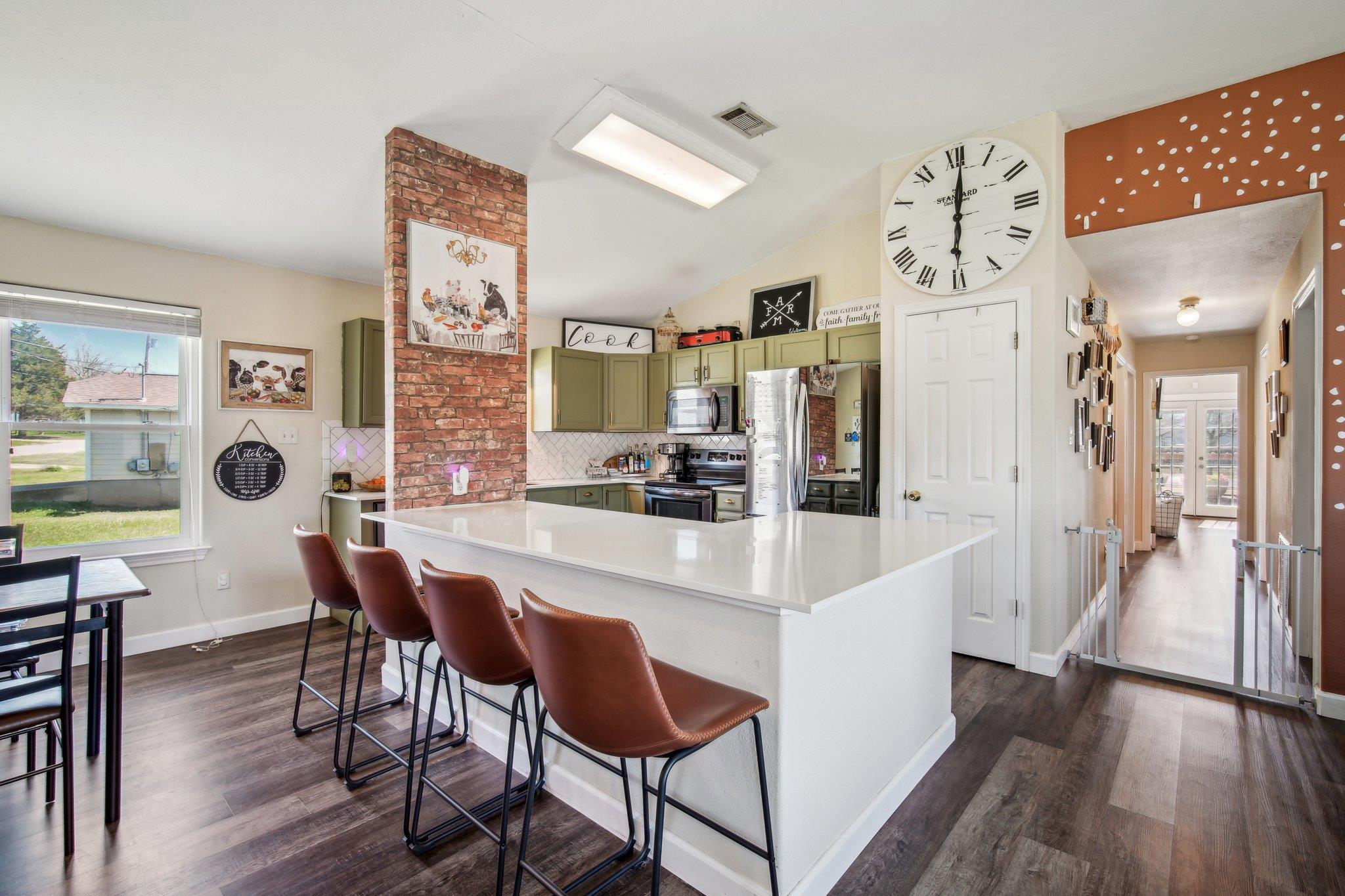 Kitchen with stainless steel appliances, green ca