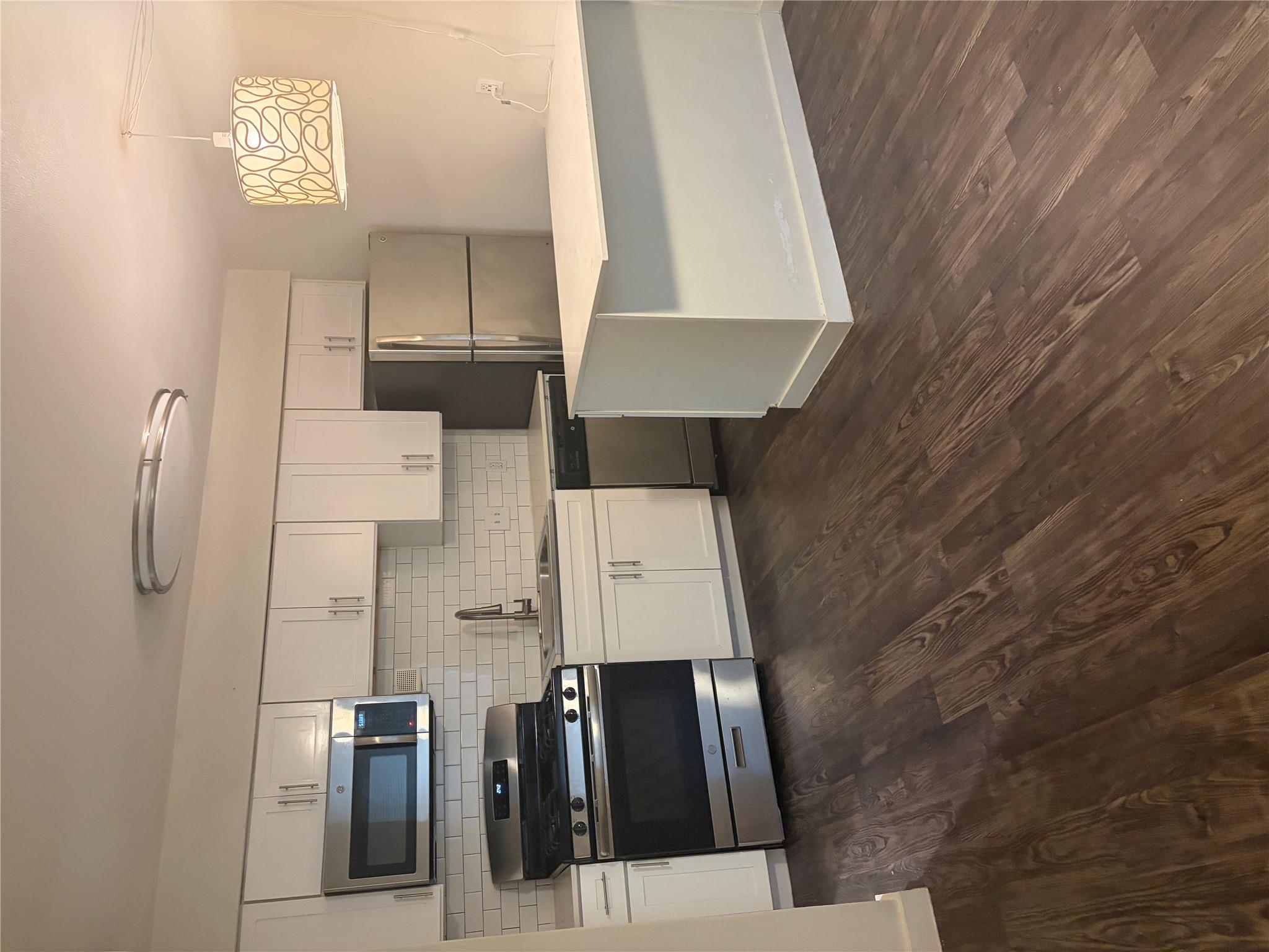 Bright, efficient kitchen with stainless steel ap