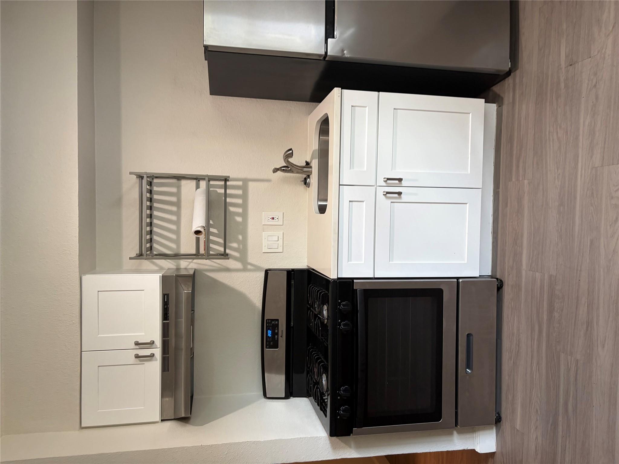A compact kitchen with sleek appliances and abund