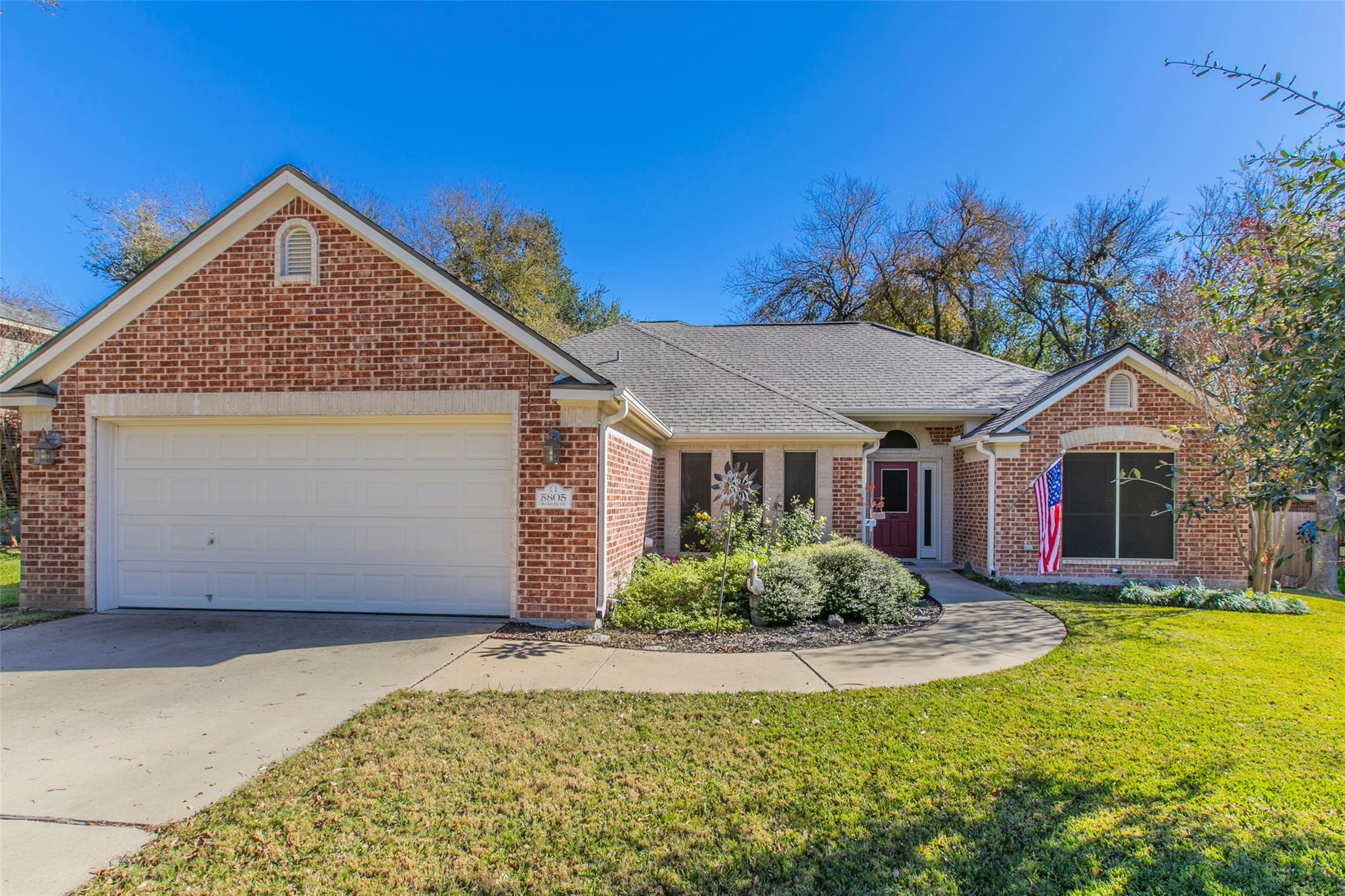 Single story home with concrete driveway, an atta