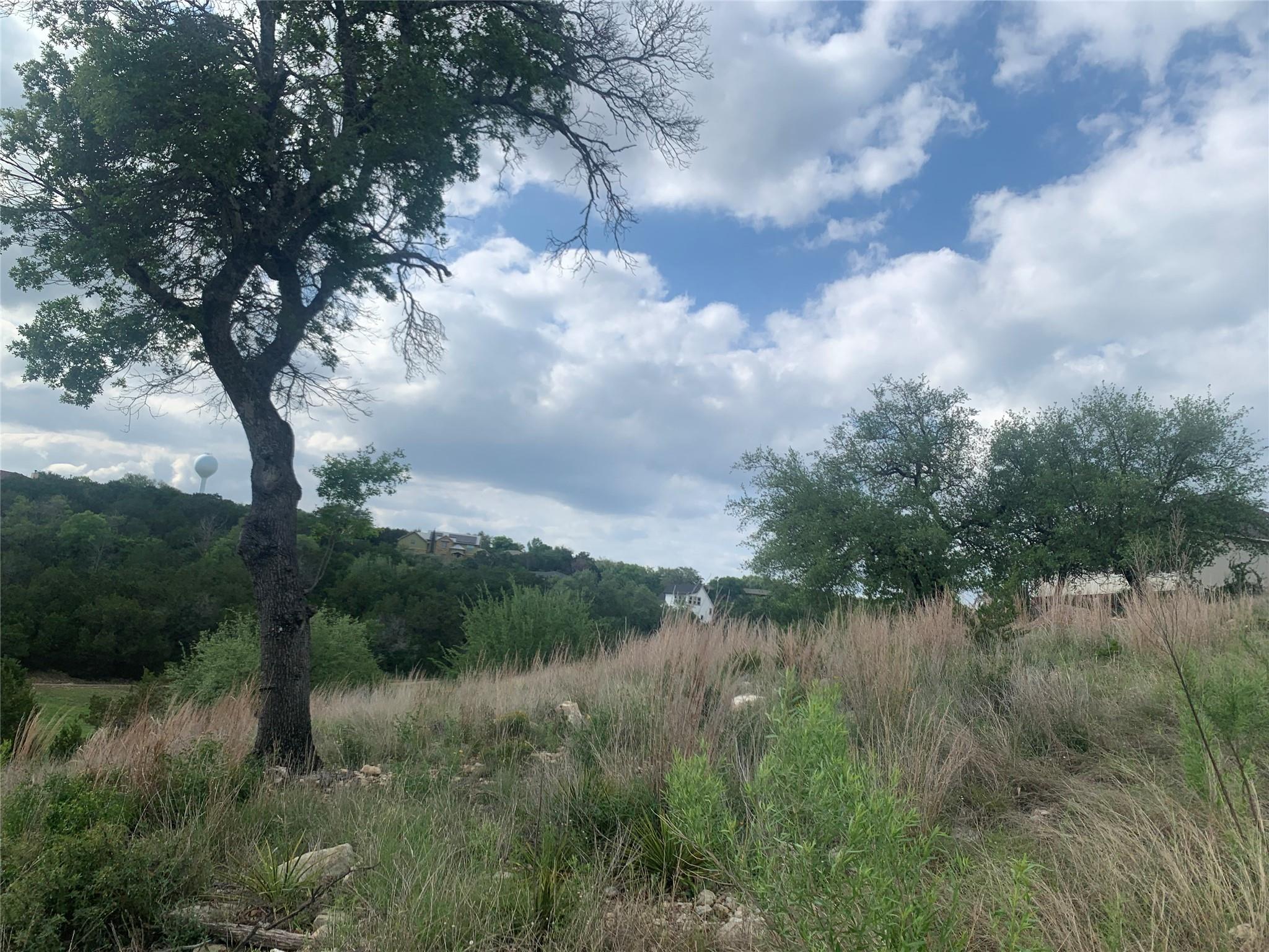 The property features a natural landscape with ma