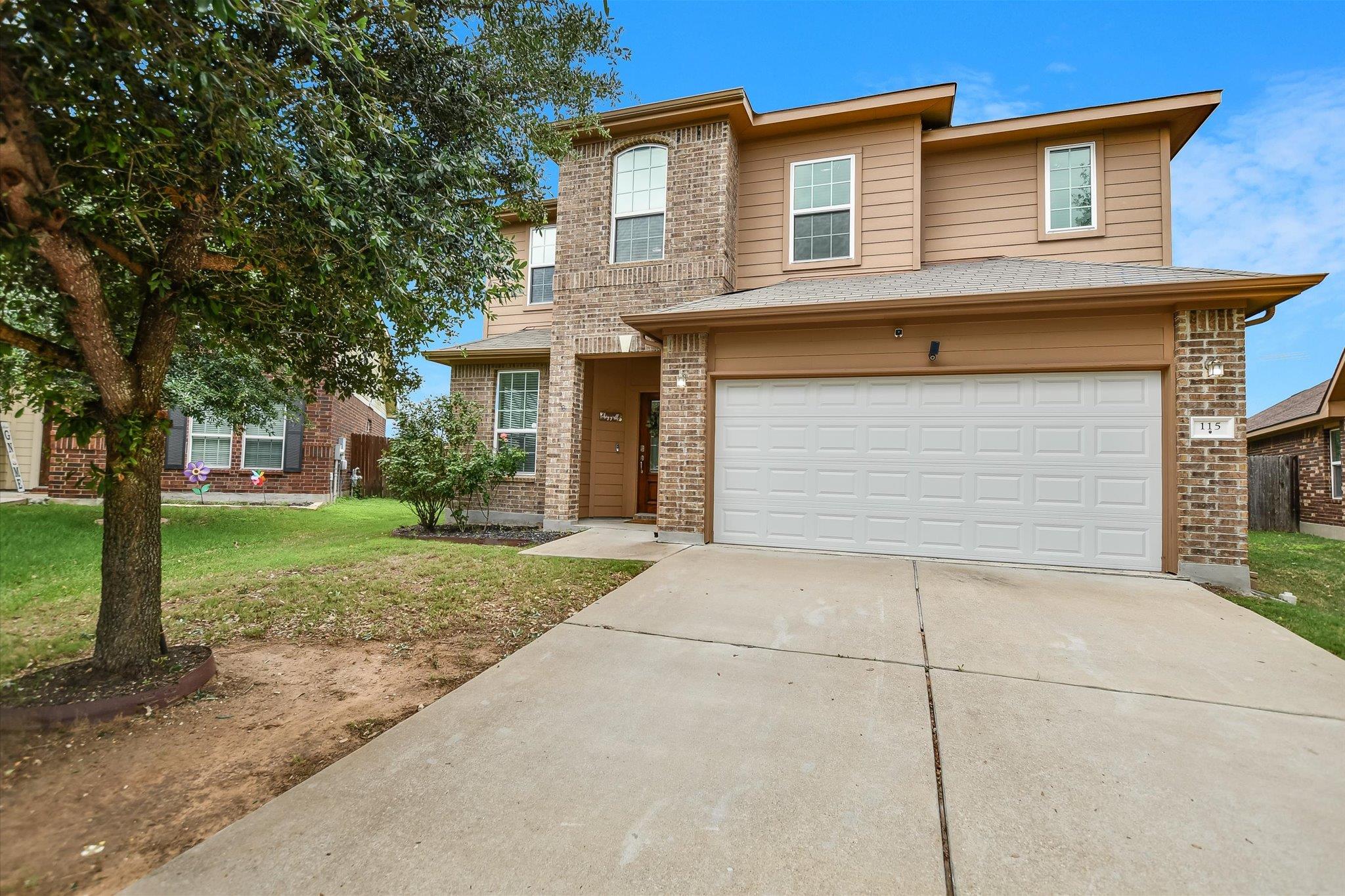 The property features a brick and siding exterior