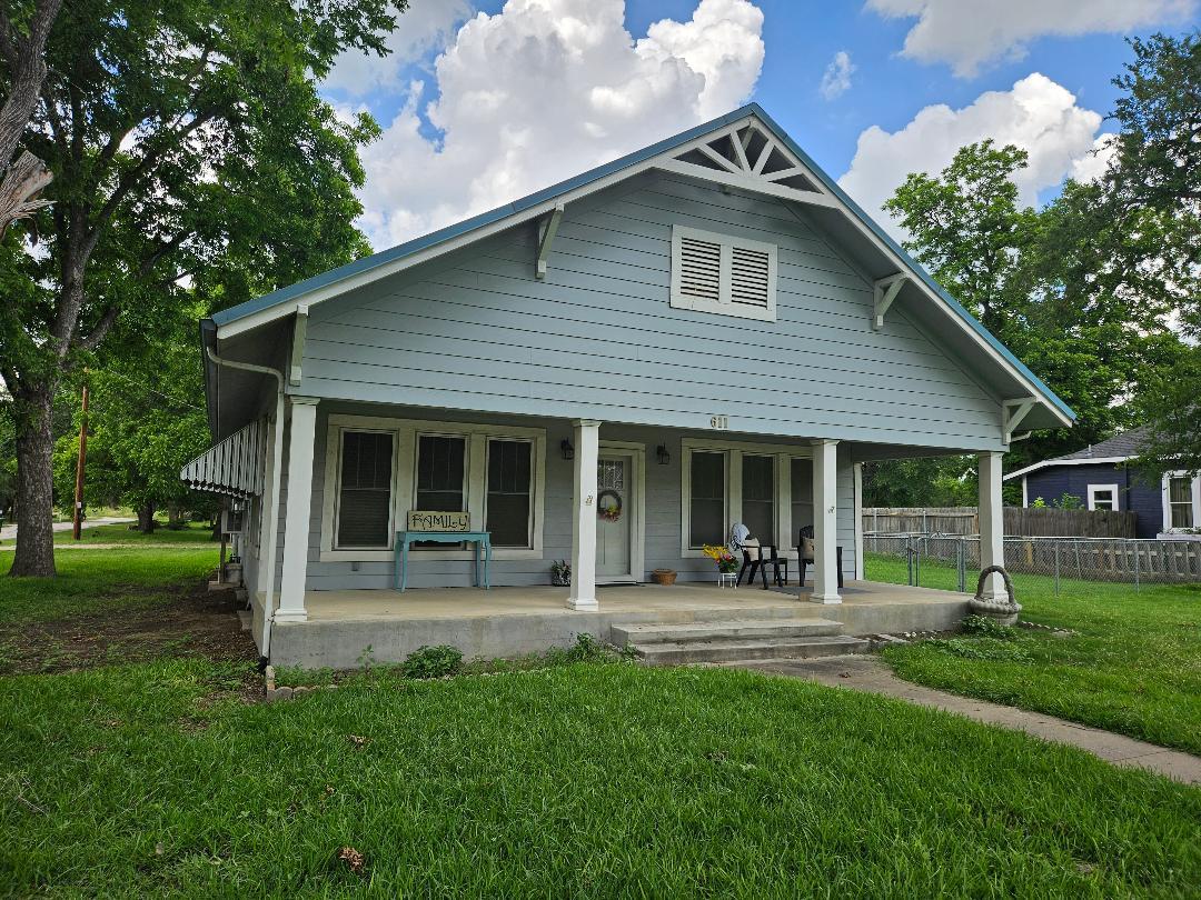 A charming home with a welcoming front porch, ide