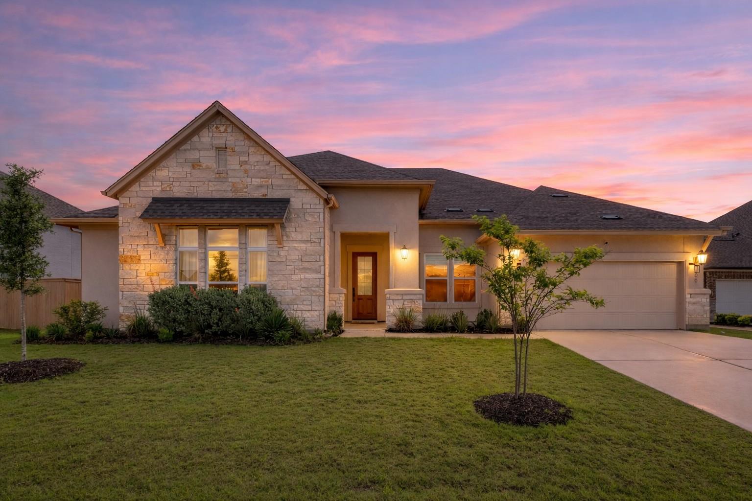 The property features a stone and stucco exterior