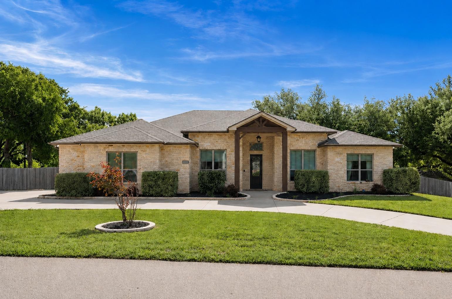 An inviting stone exterior welcomes you to this h