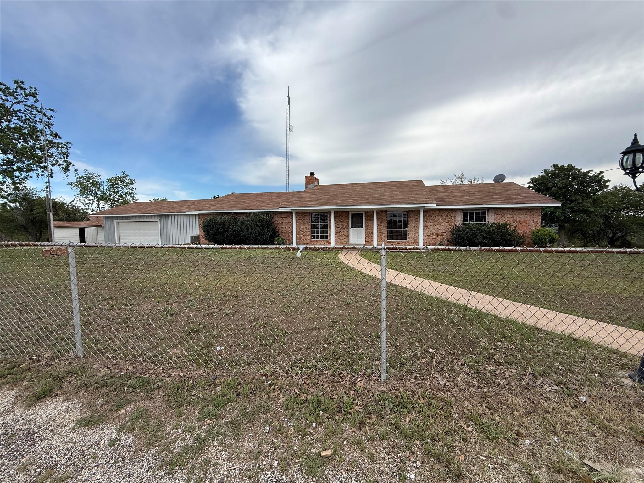 The property features a brick exterior with a lig