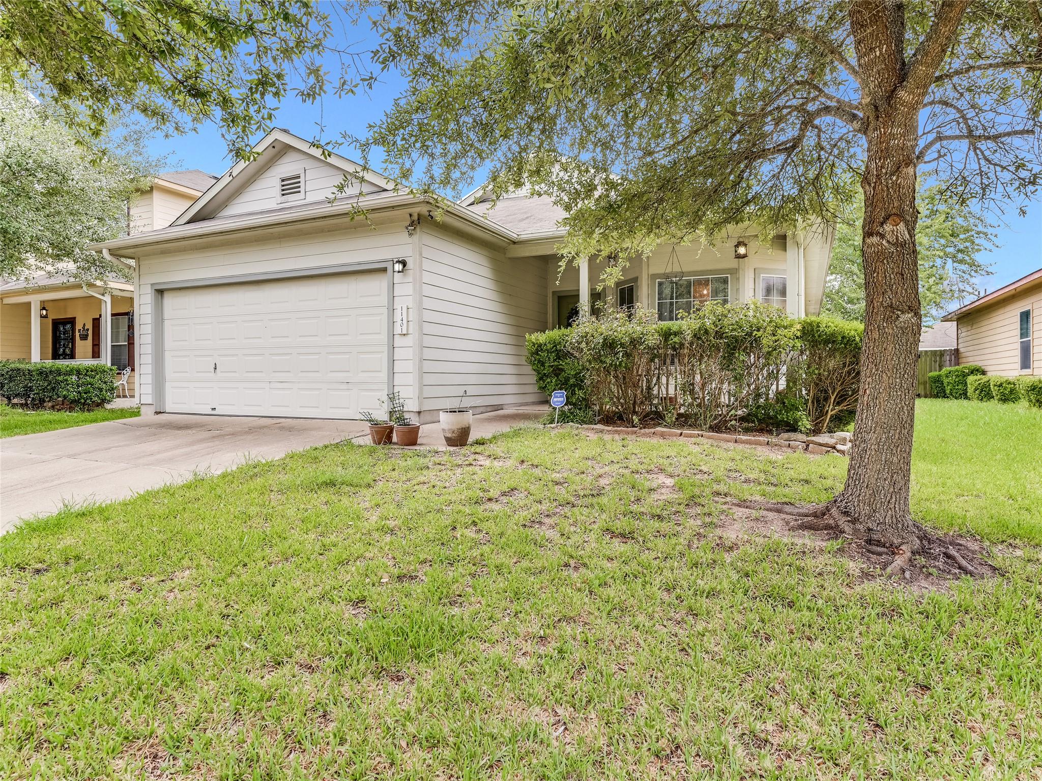 The property features a front-facing garage, a pa