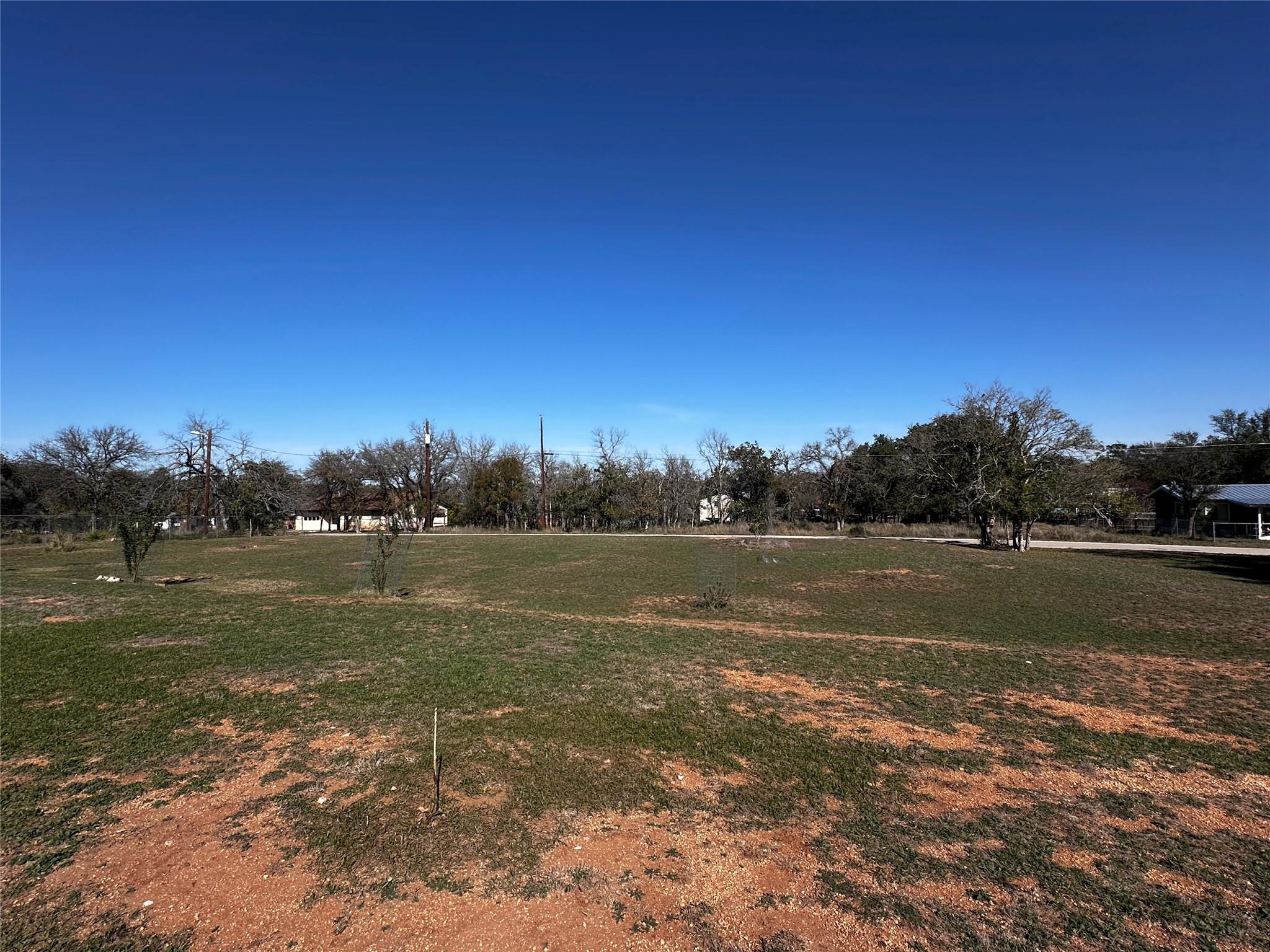 An expansive lot featuring natural landscaping an