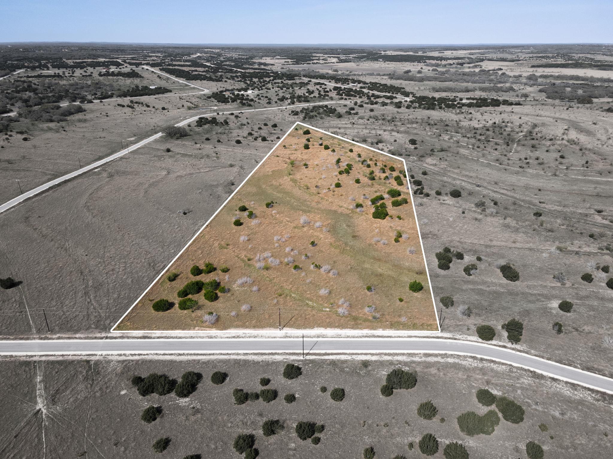 The property offers expansive open land with scat