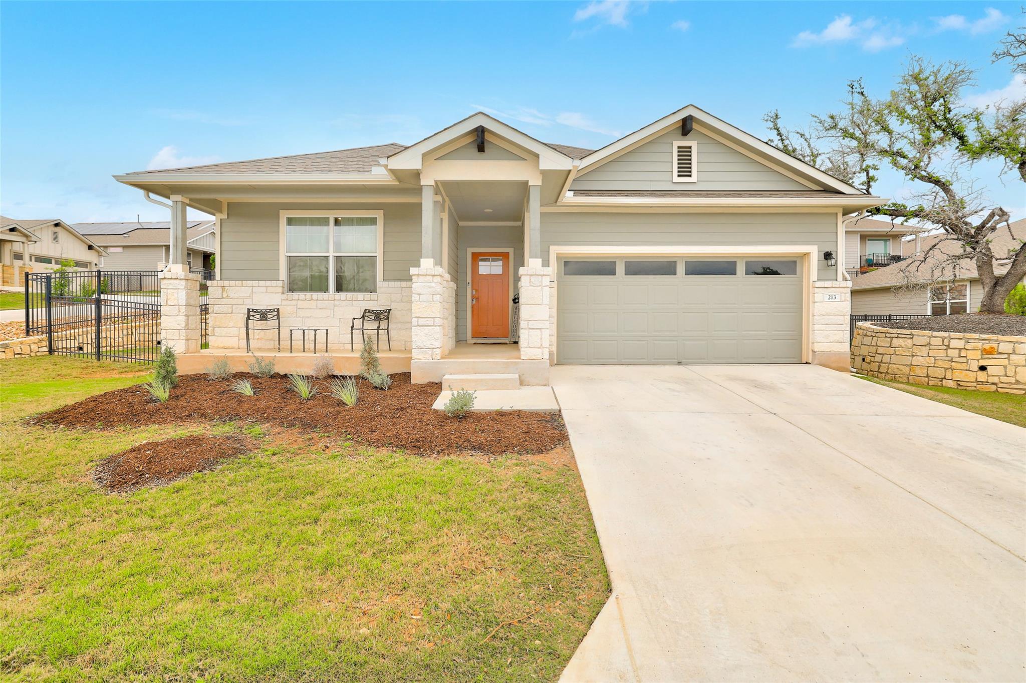 The property features a well-maintained front yar