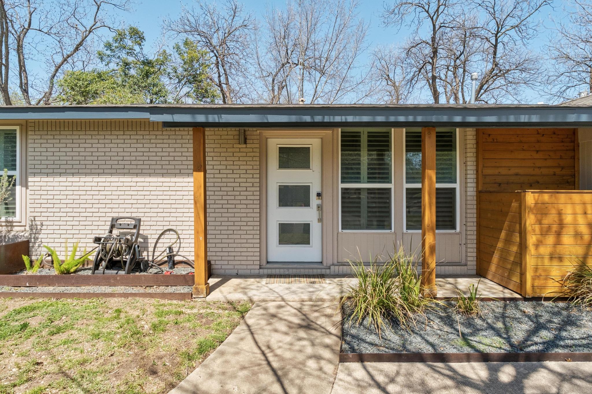 The property features a brick exterior with a fla