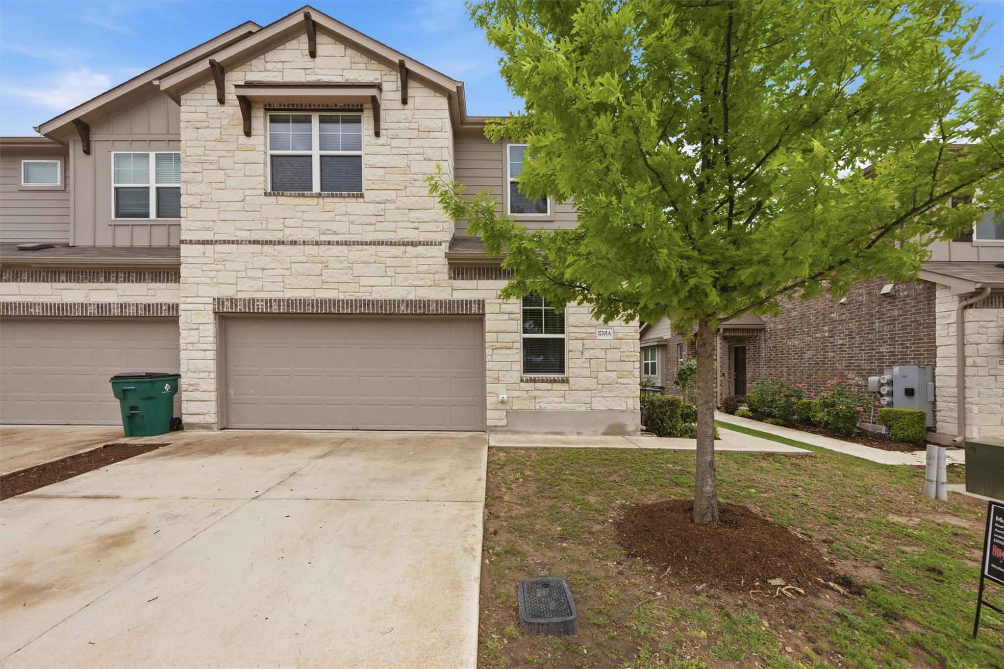 The property features an exterior with light-colo
