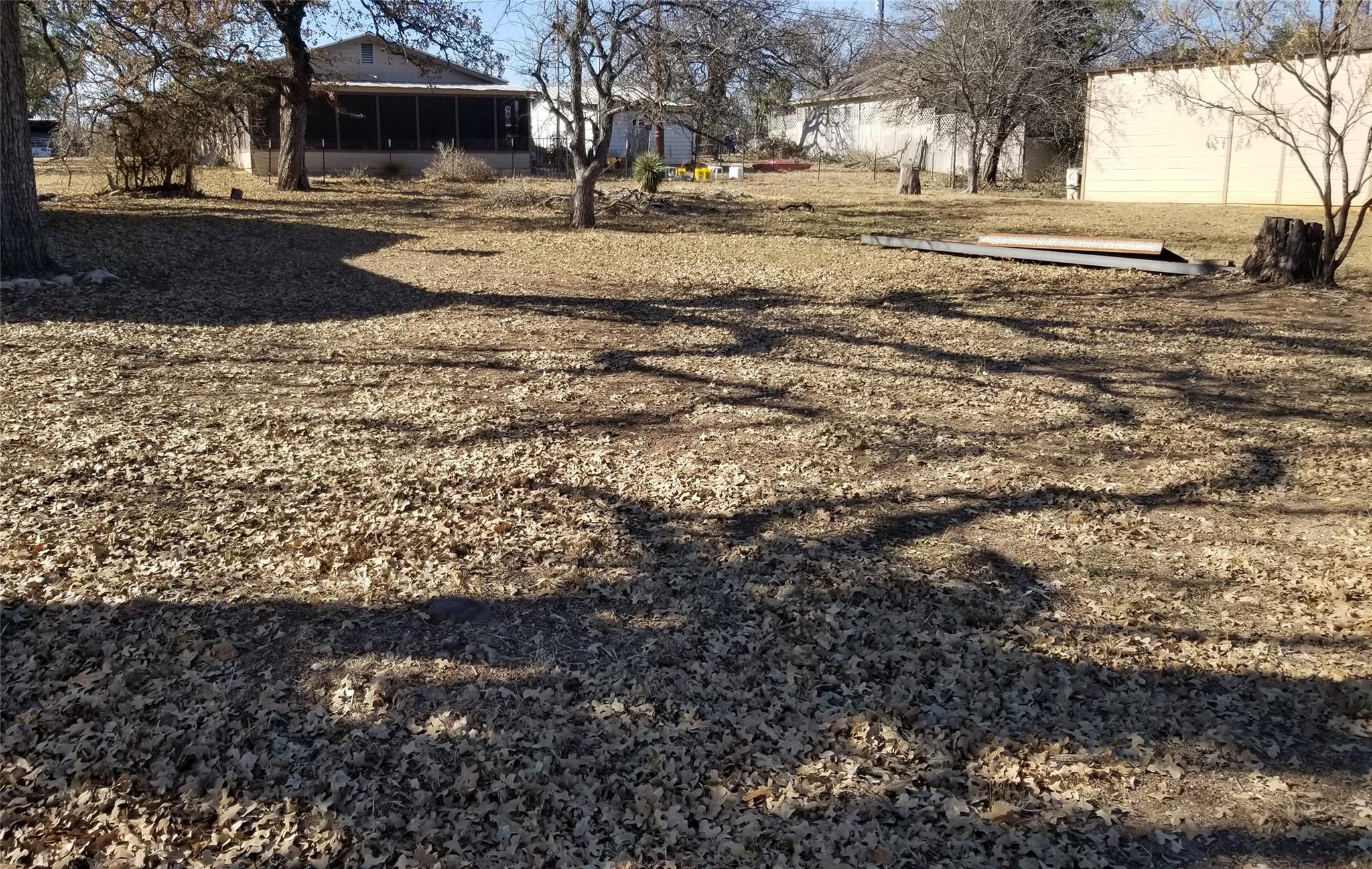 This property features an expansive yard with mat