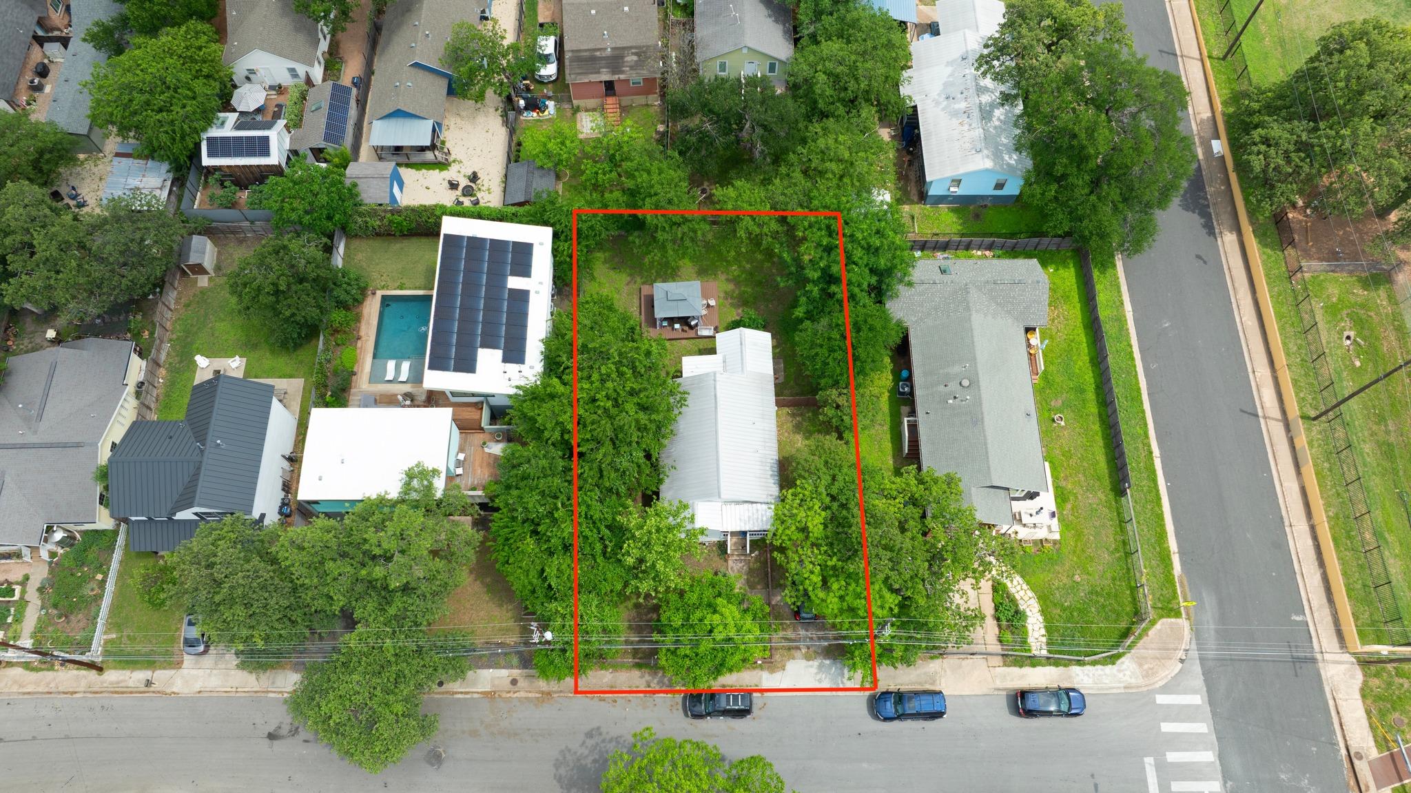 Aerial view showcasing a residential property wit
