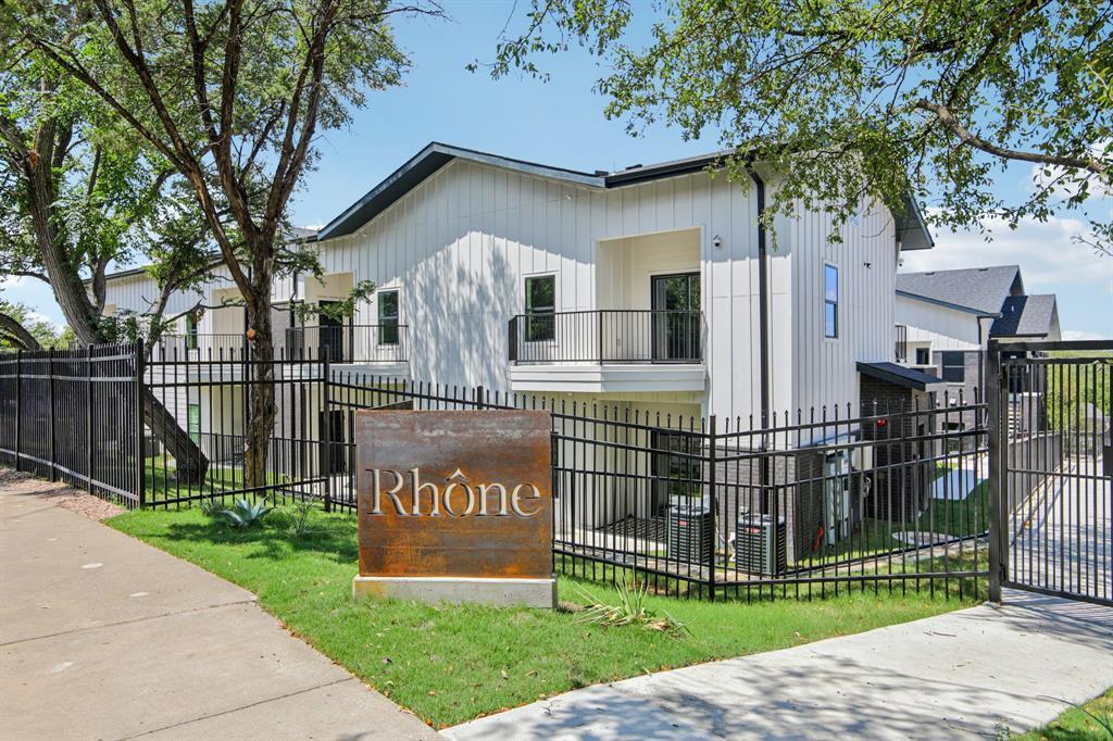 The property features a modern exterior with whit