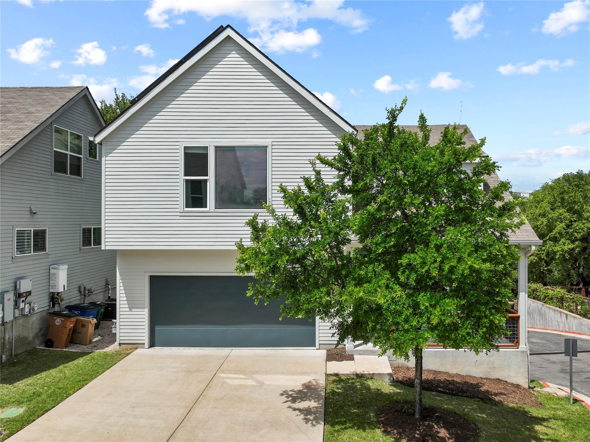 The property features light-colored siding, a dar