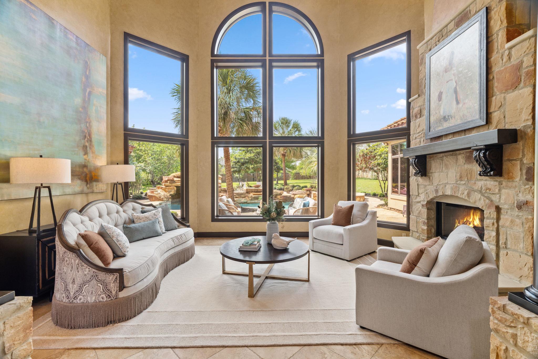 This living area features a stone fireplace with 