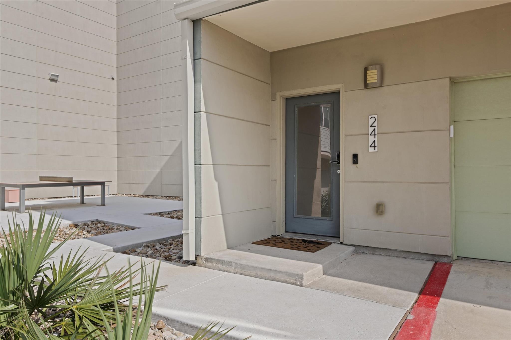 Modern exterior entryway featuring a glass-panele