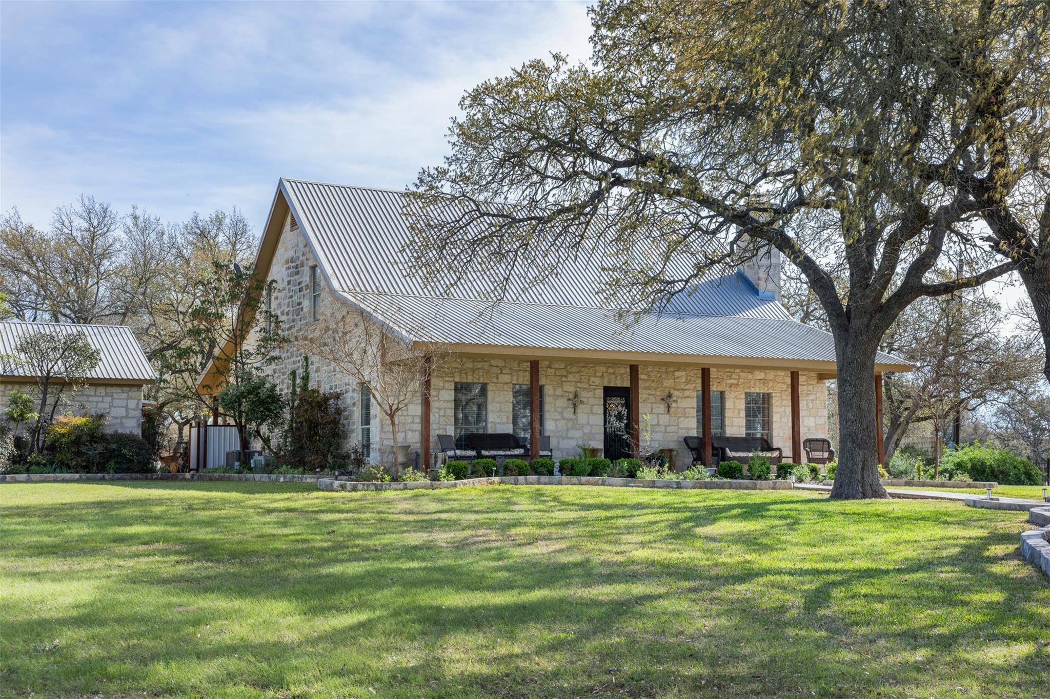 The property features a stone exterior and a meta