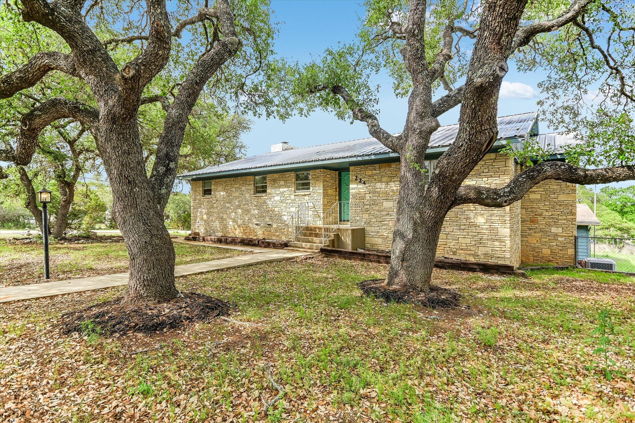 The property features a stone exterior and a meta