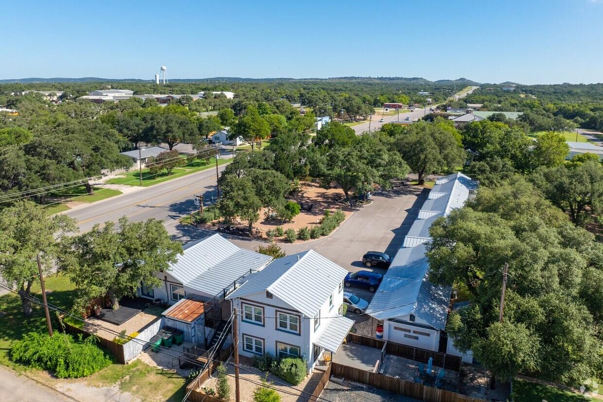Aerial view showcasing the property's exterior, i