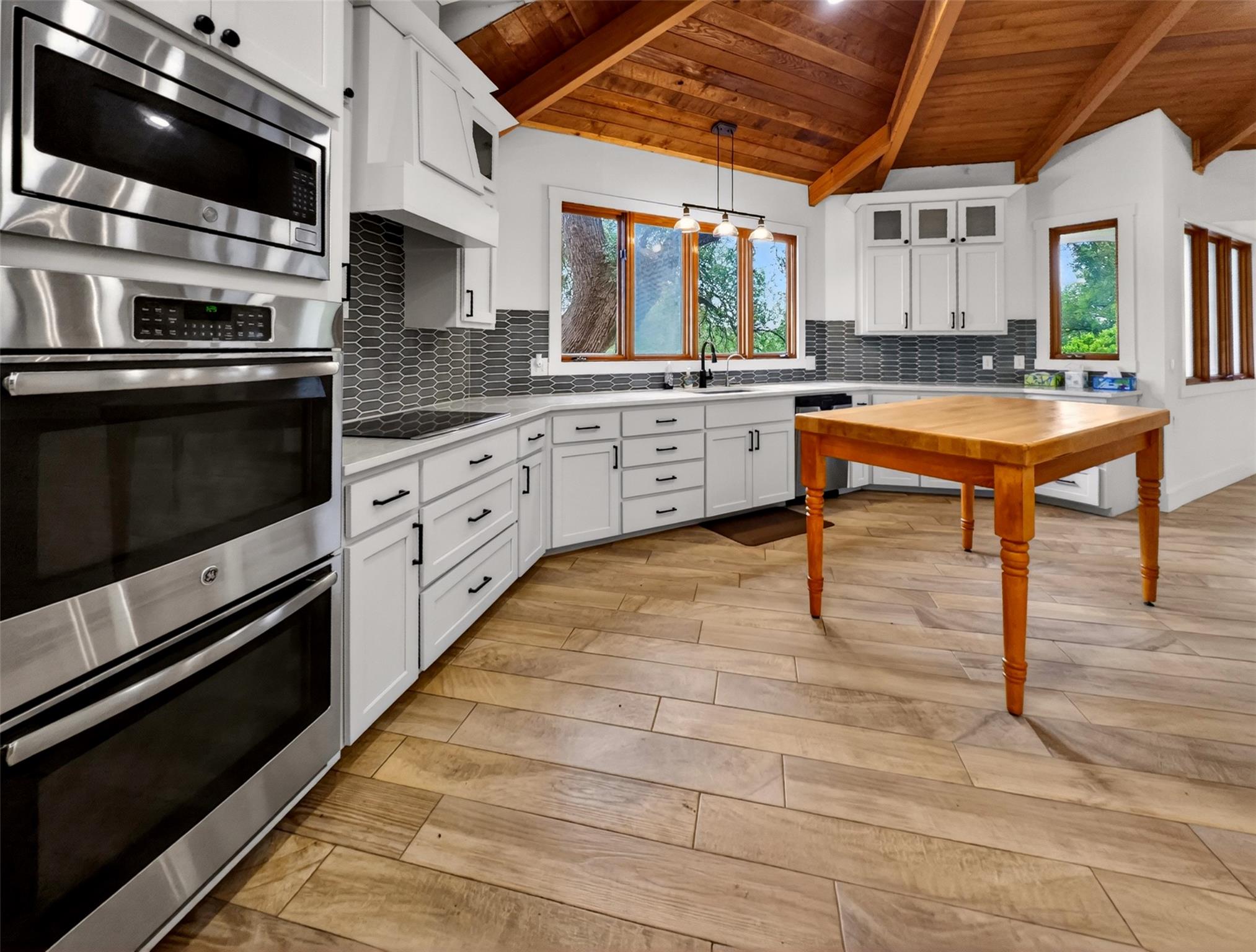 Well-appointed kitchen featuring a vaulted wood-p