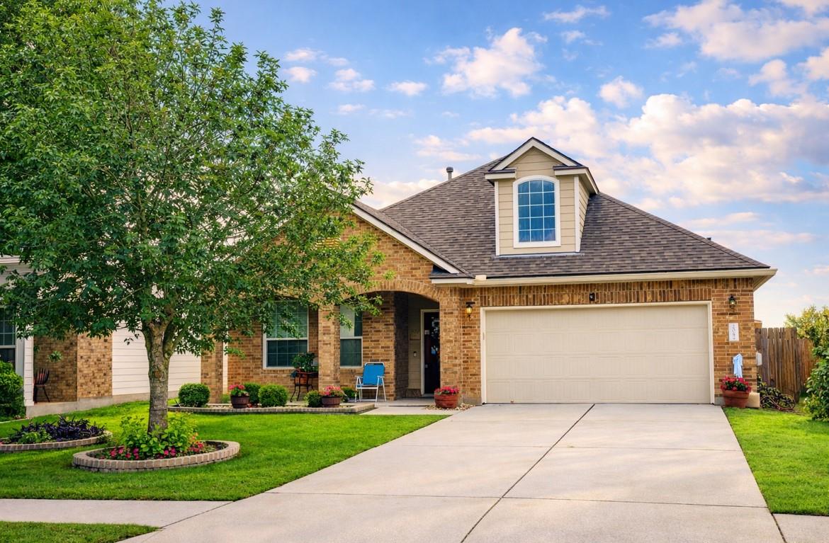The property features an attached garage, a dorme