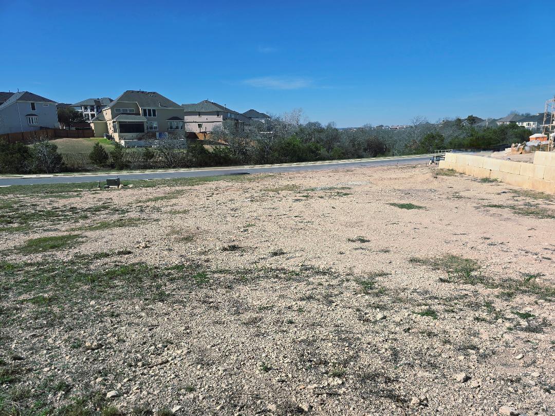 Expansive lot with a gravel and sparse grass grou