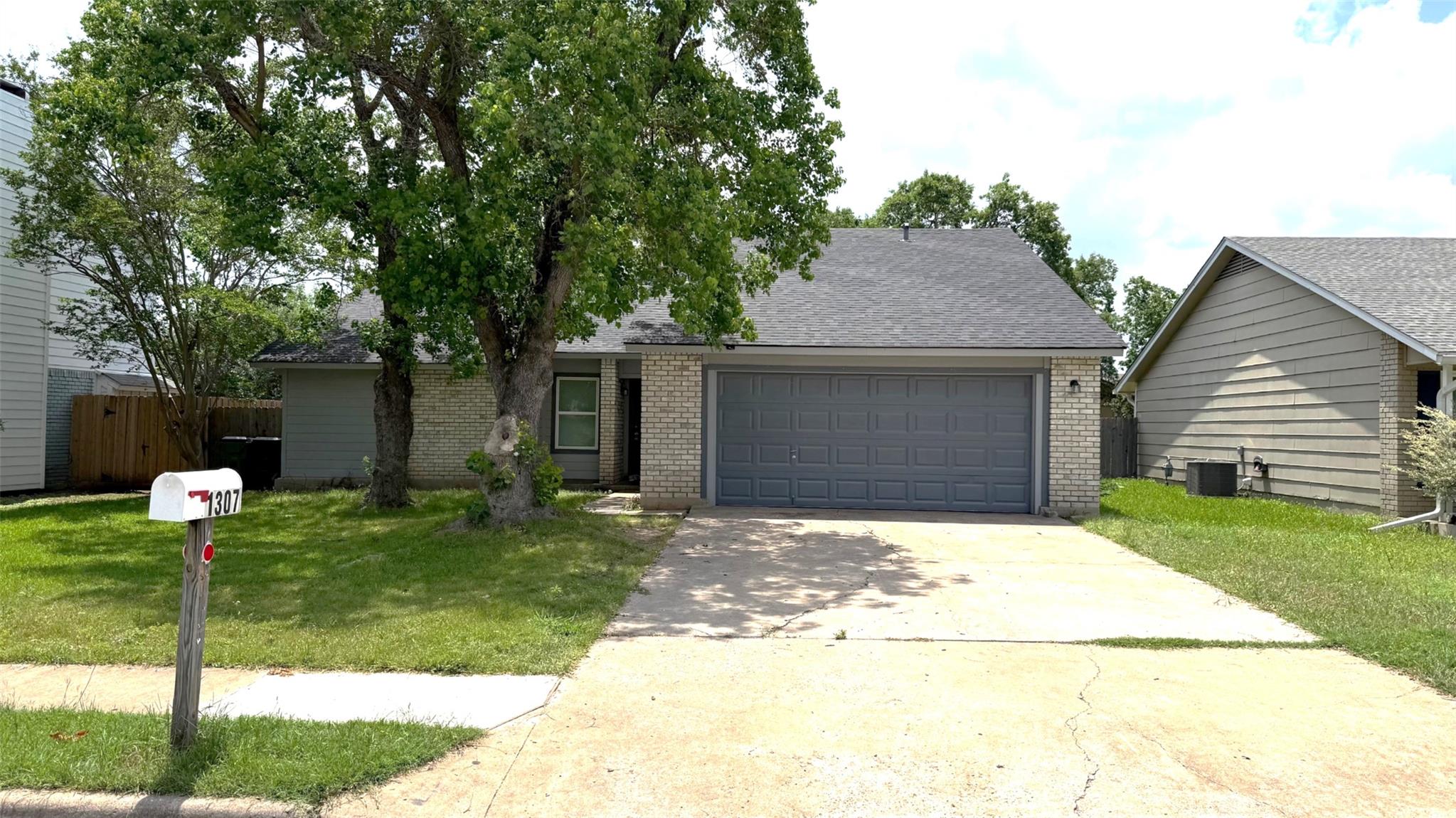 The property features a brick and siding exterior