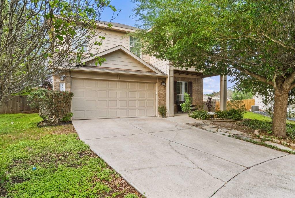 Two-story exterior with a two-car garage and a co