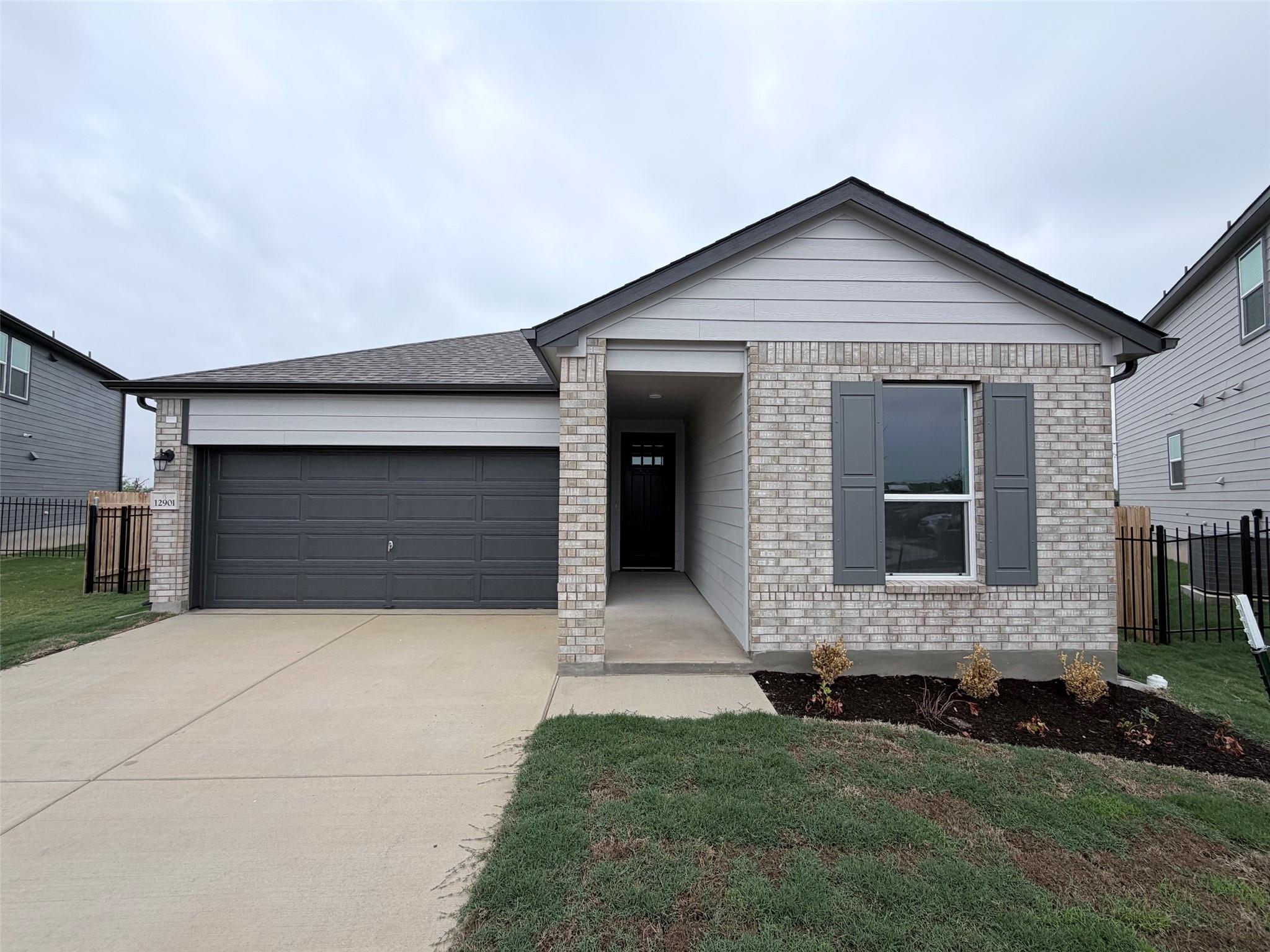 Contemporary single-story residence with a brick 