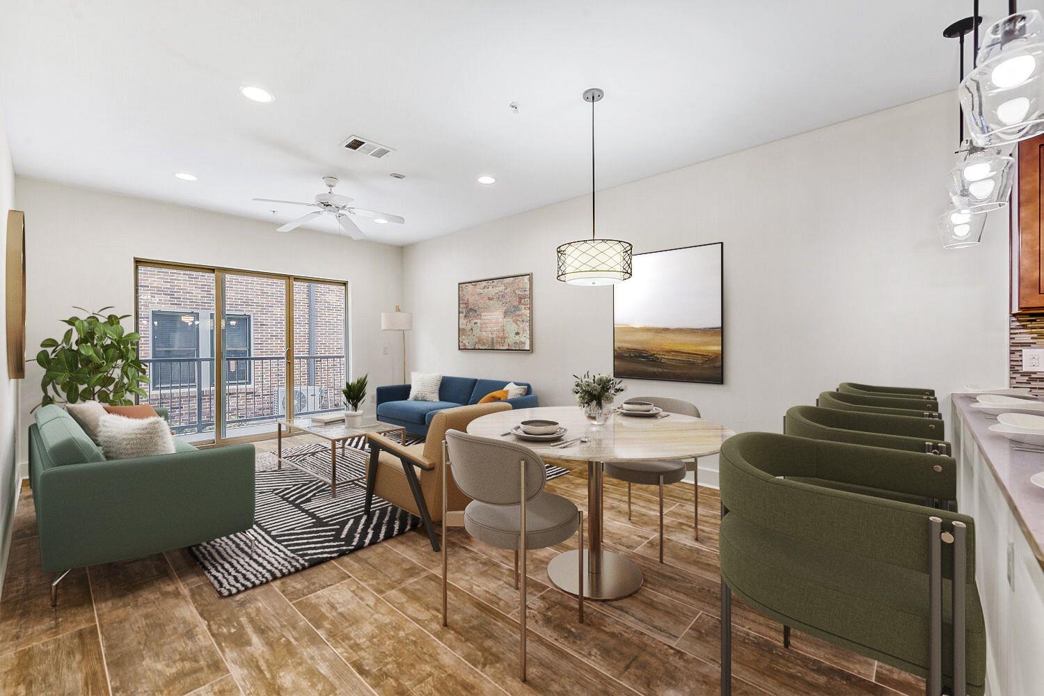 The open concept living area features hardwood fl