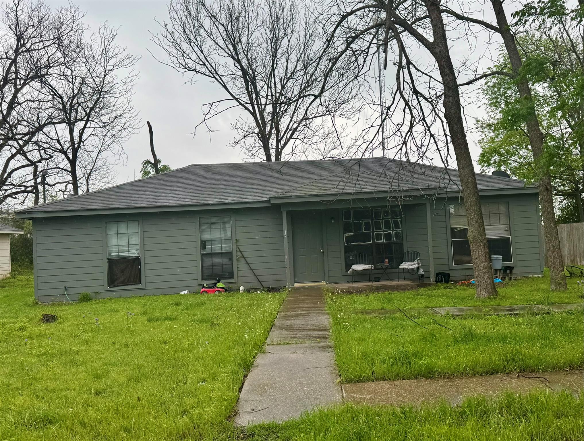 The property features a gray exterior with a dark