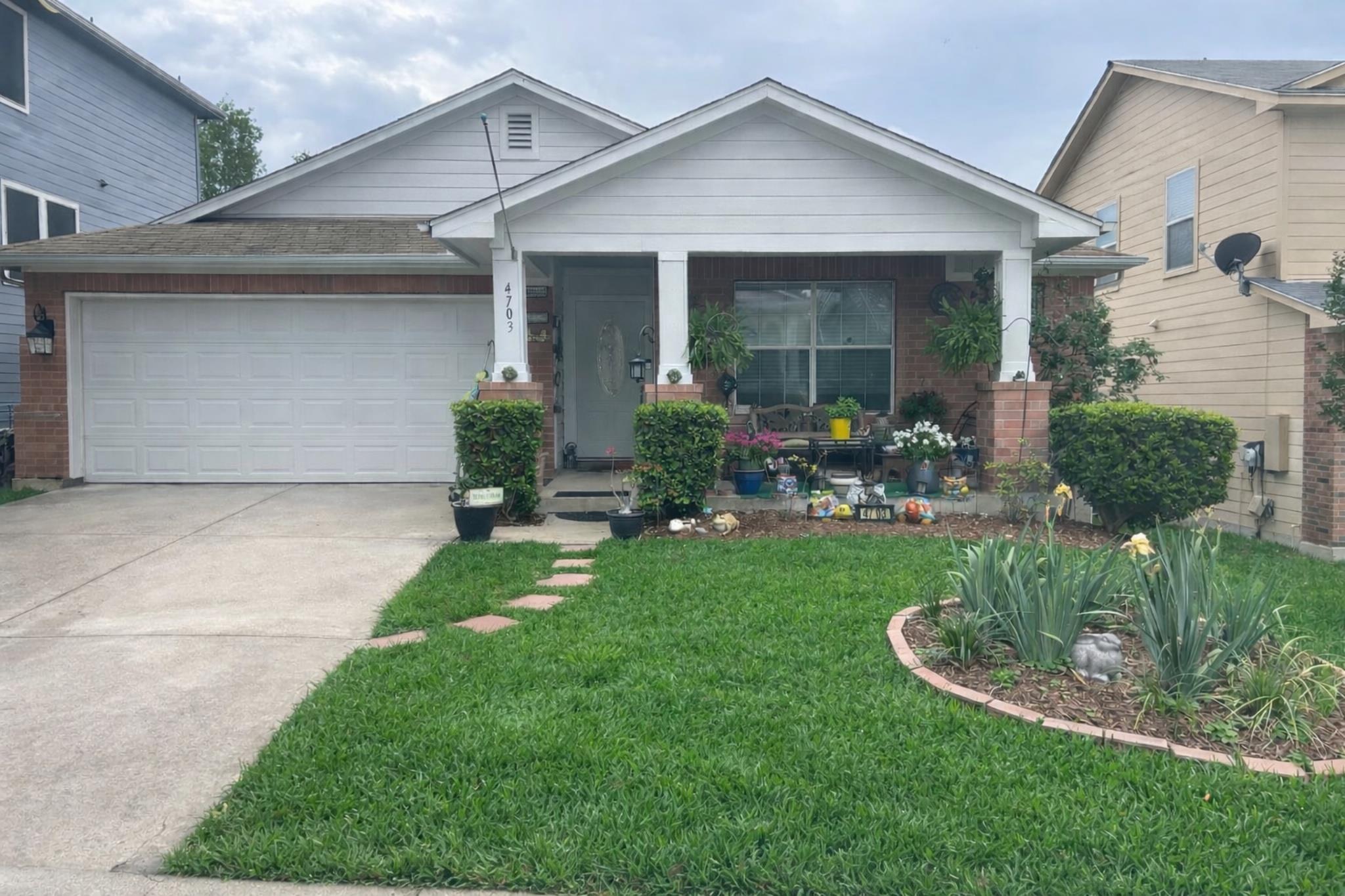 The property features a brick facade with white s
