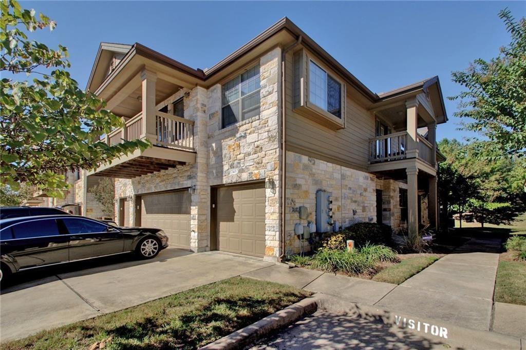 Multi-level residence featuring stone and siding 