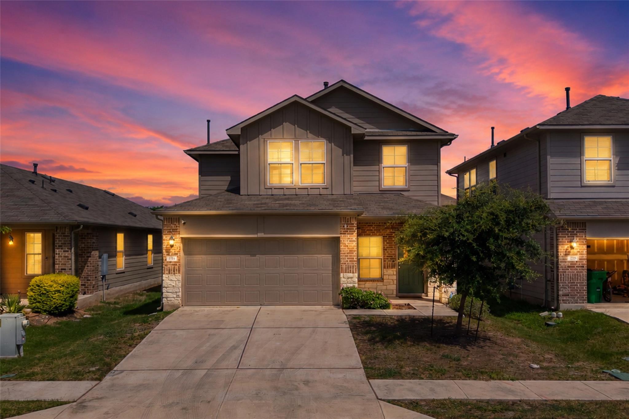 A striking two-story home features a harmonious b