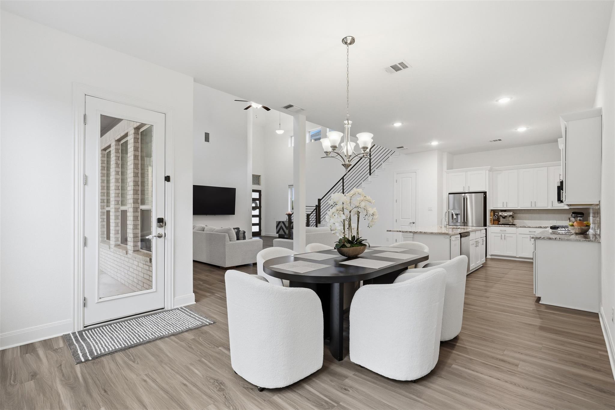 Open-concept living area featuring wood-finish fl