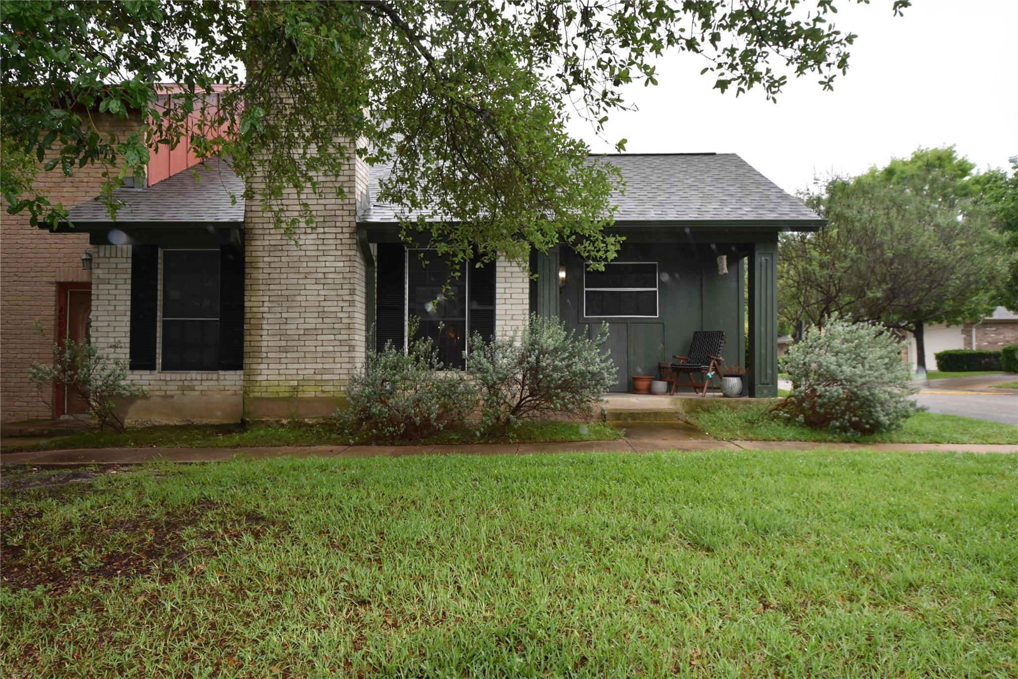 Exterior featuring light-colored brick siding and