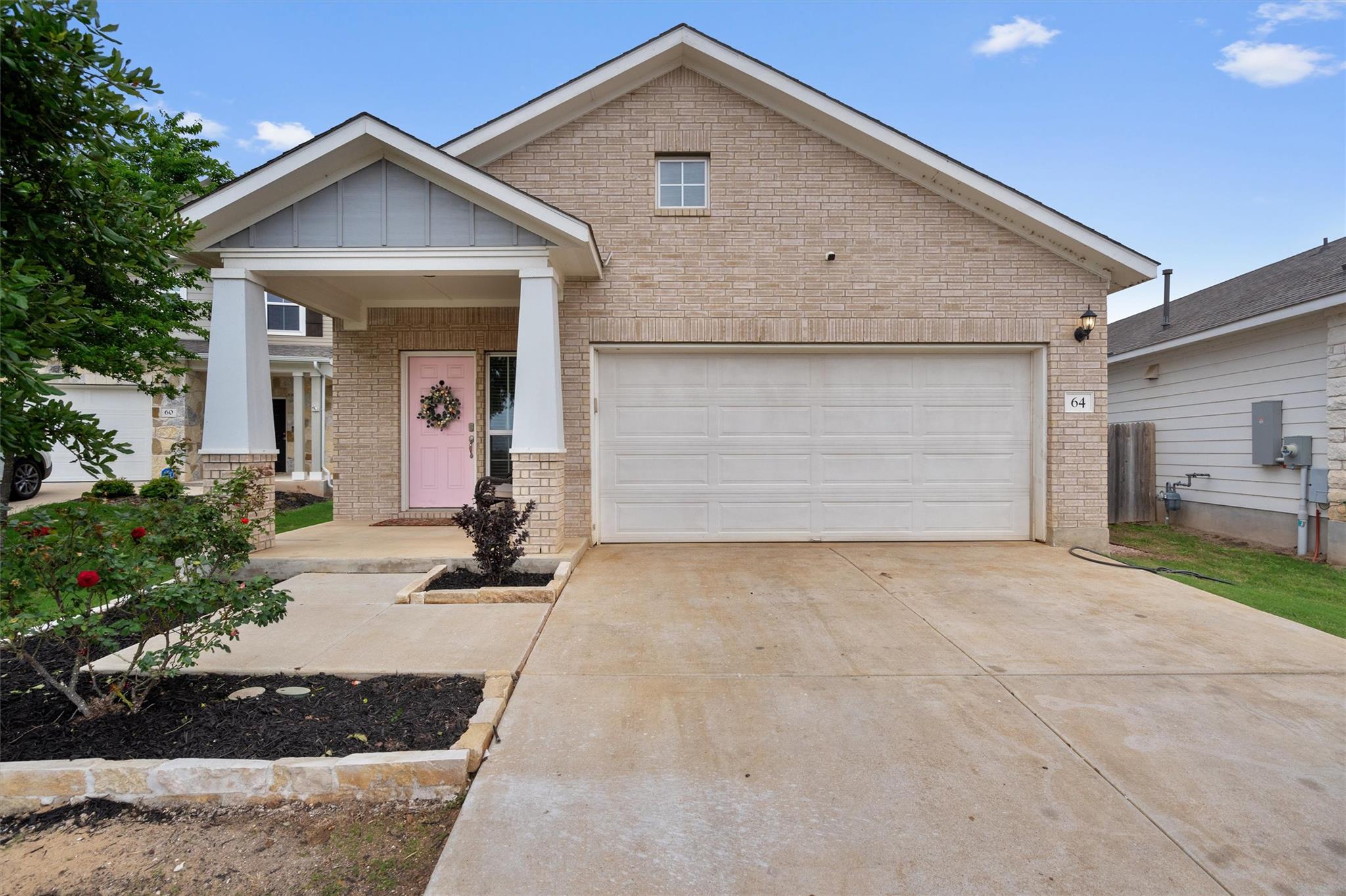 The property features a light brick exterior with